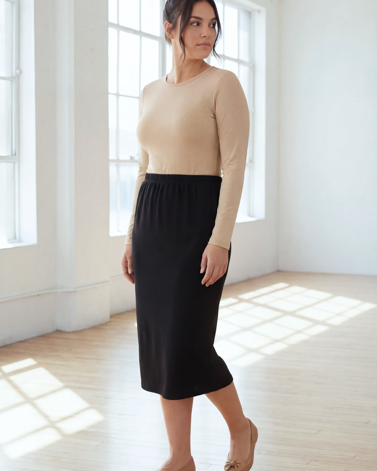 Model wearing Nuggles® 31" Classic Skirt in Black