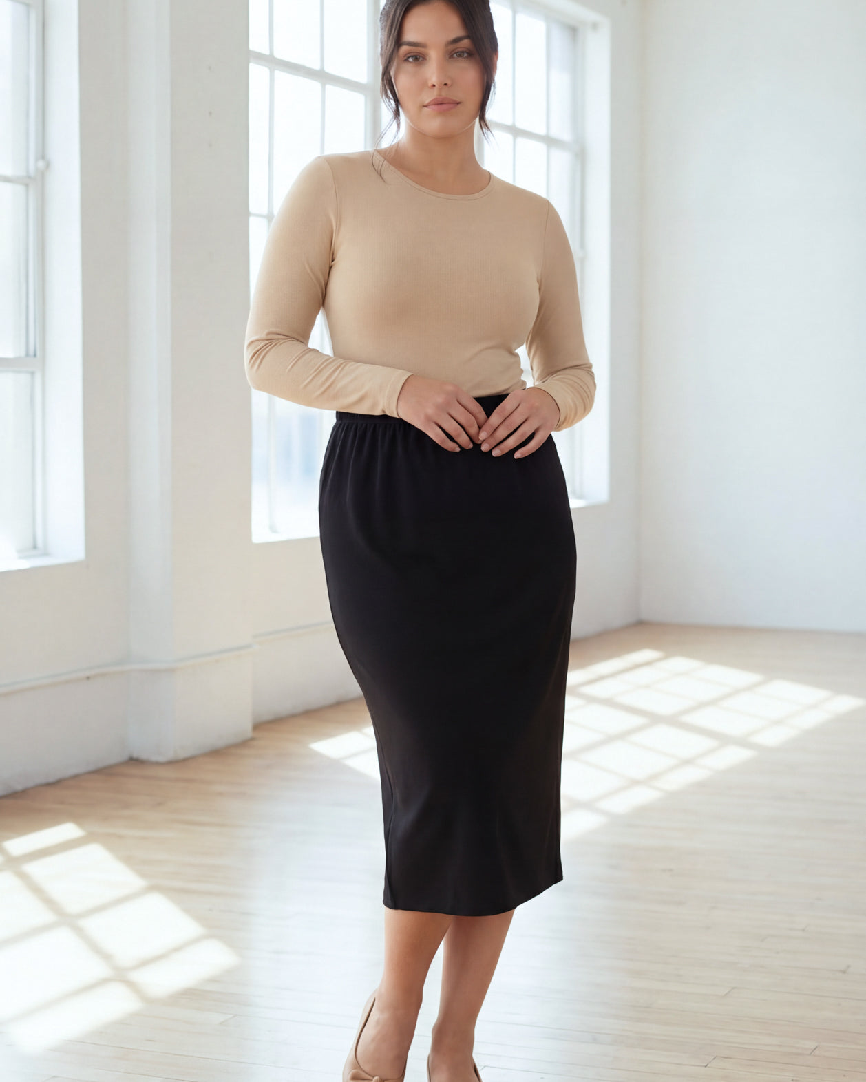 Model wearing Nuggles® 31" Classic Skirt in Black