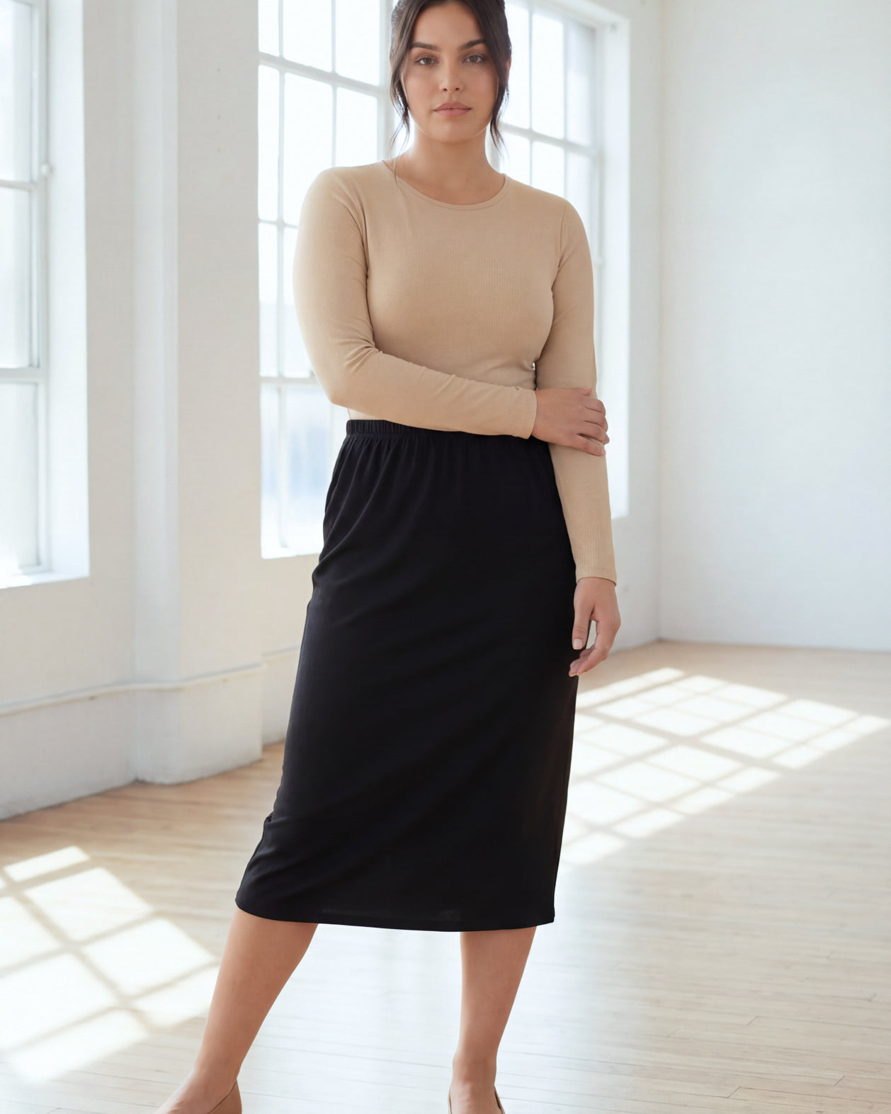 Model wearing Nuggles® 31" Classic Skirt in Black