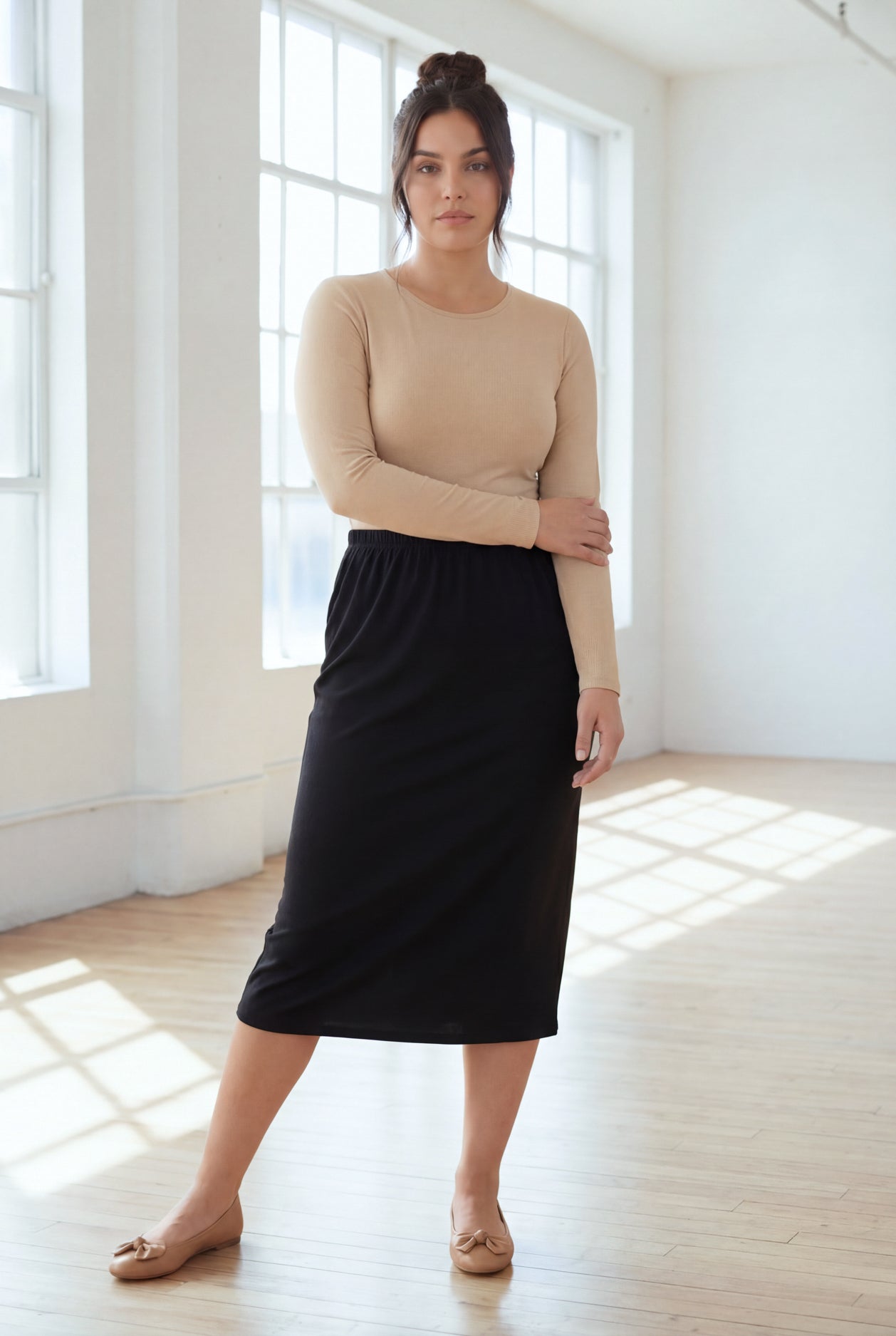 Model wearing Nuggles® 31" Classic Skirt in Black