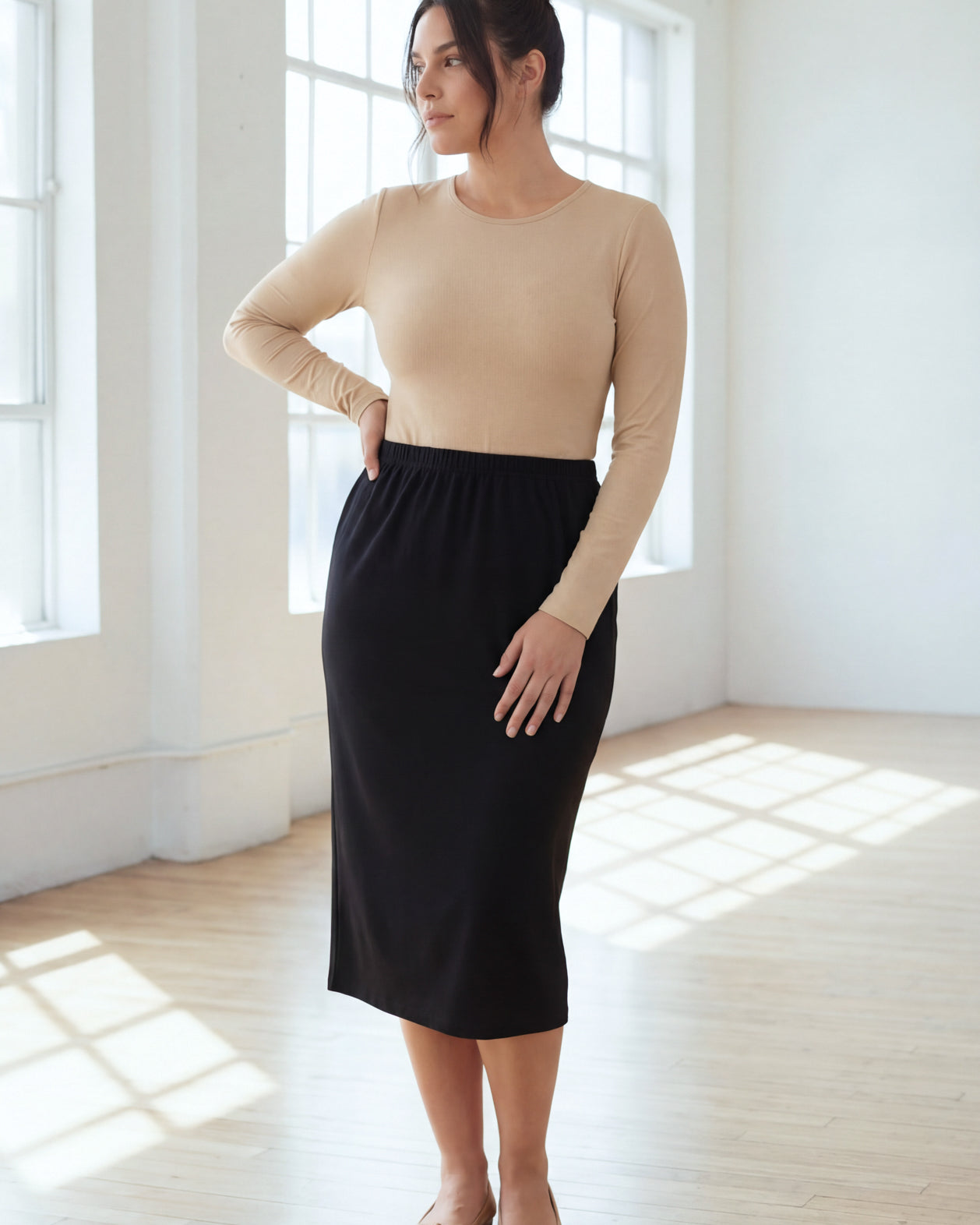 Model wearing Nuggles® 31" Classic Skirt in Black