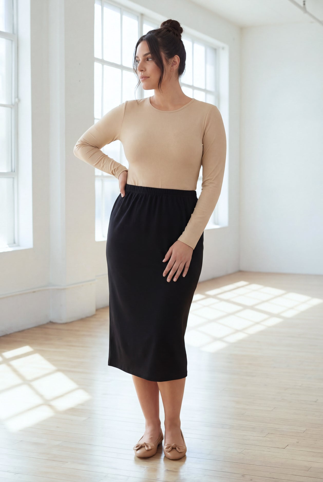 Model wearing Nuggles® 31" Classic Skirt in Black