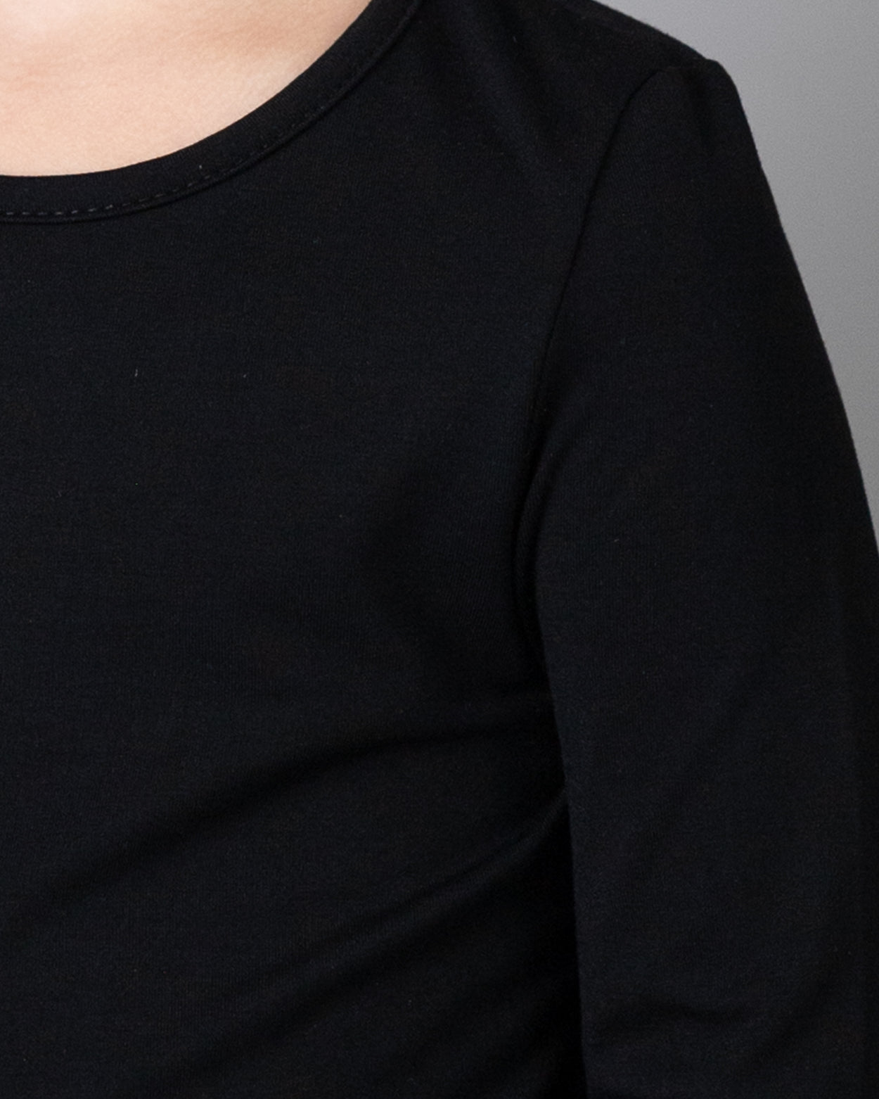 Close up detail shot of the black fabric.