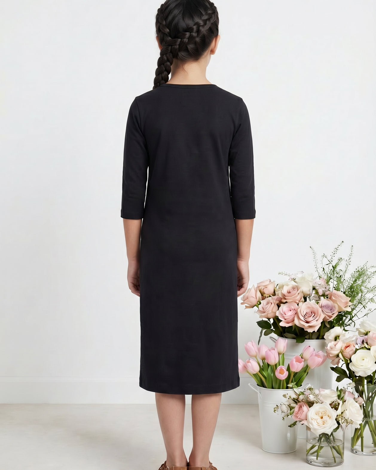Model wearing Nuggles® Girls Midi Layering Dress in Black