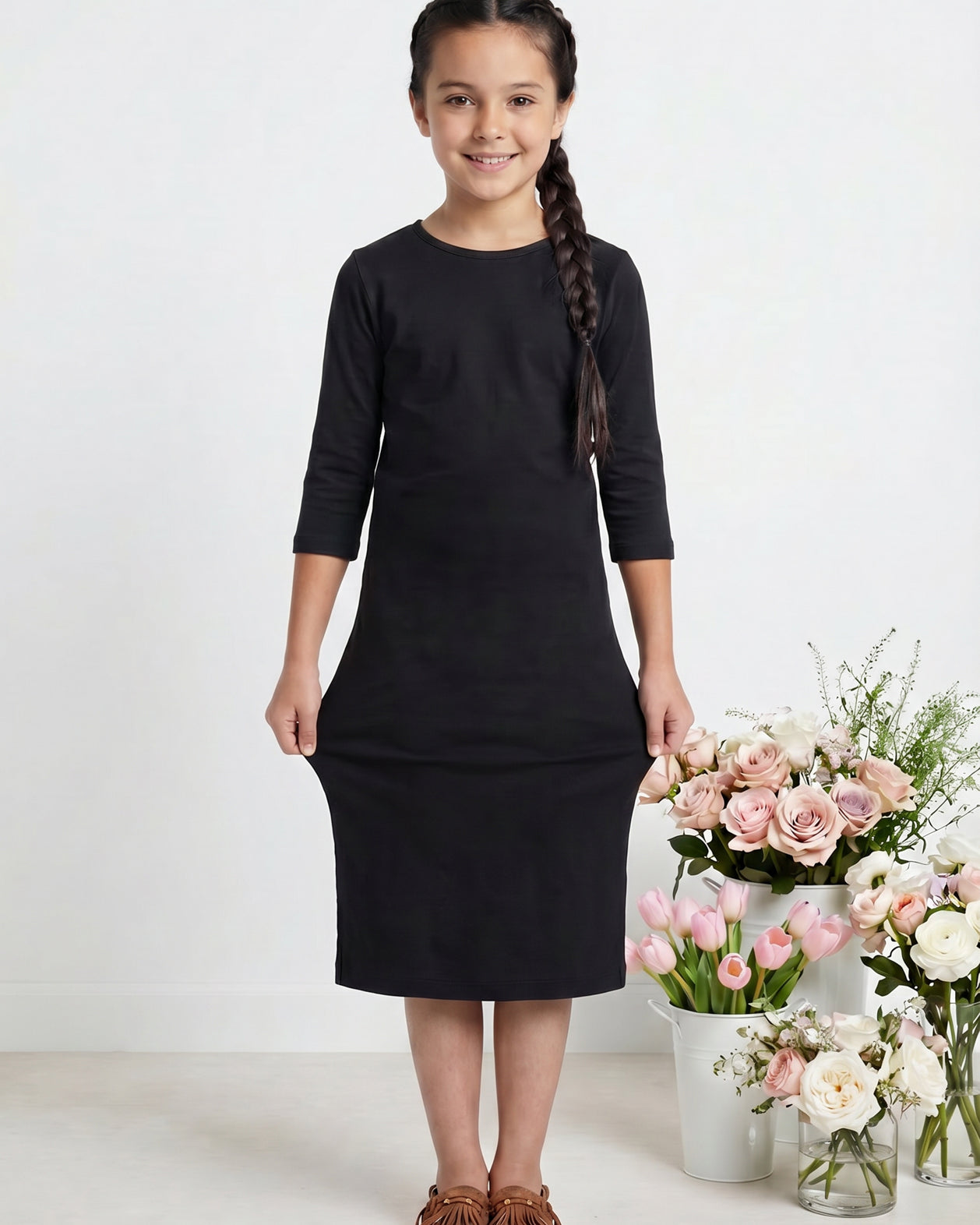Model wearing Nuggles® Girls Midi Layering Dress in Black