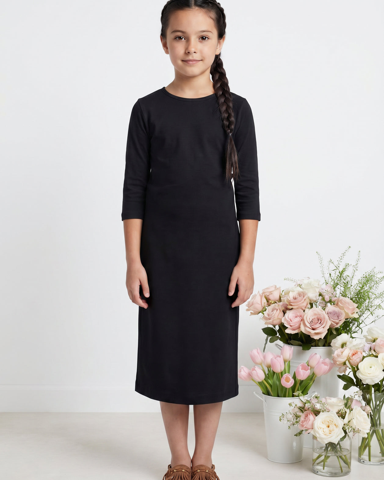 Model wearing Nuggles® Girls Midi Layering Dress in Black