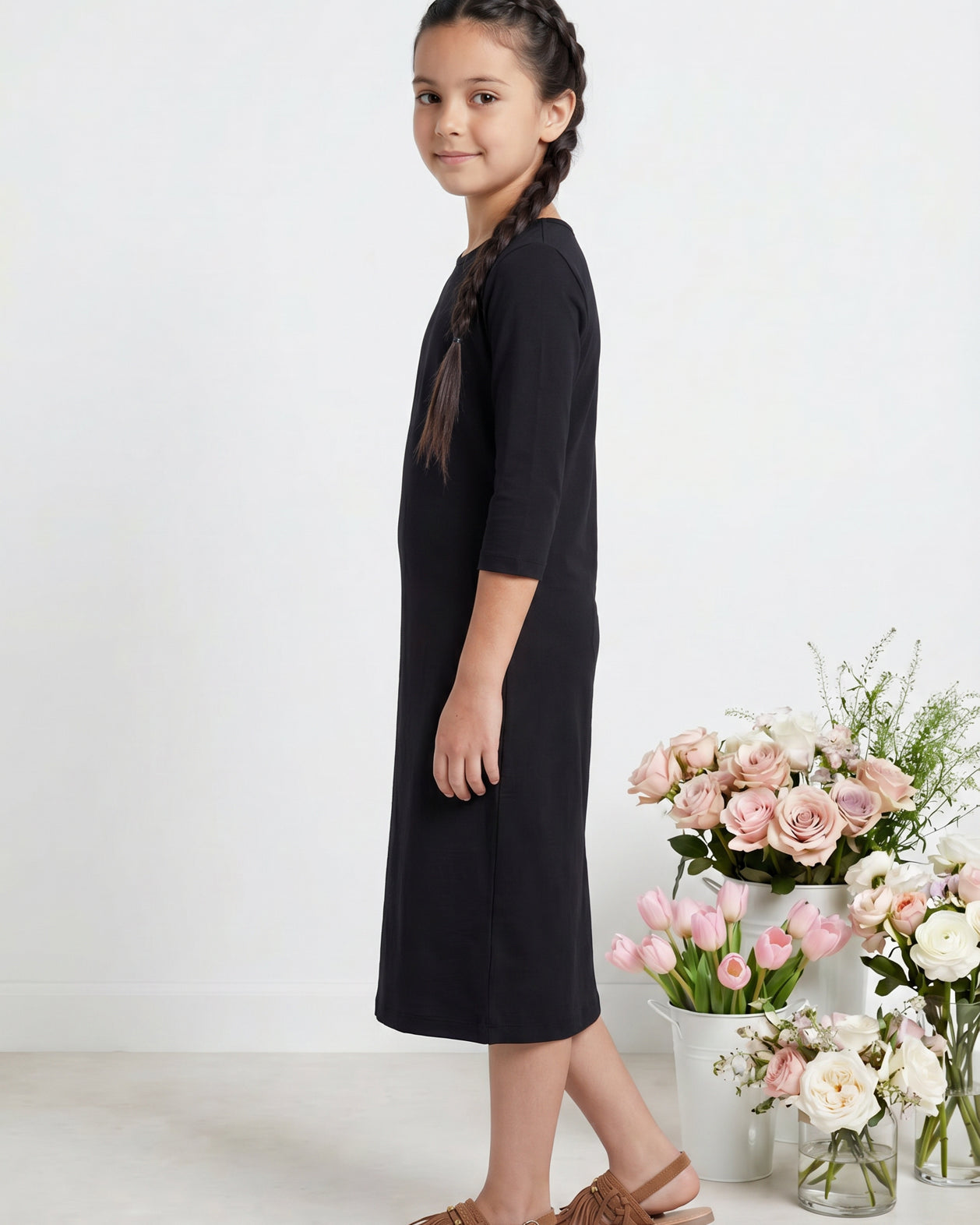 Model wearing Nuggles® Girls Midi Layering Dress in Black