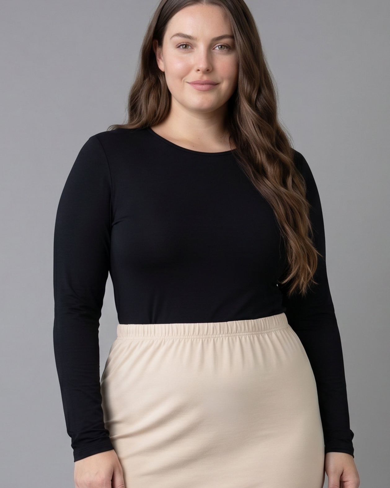 Model wearing Nuggles® Long Sleeve Essential Tee in Black