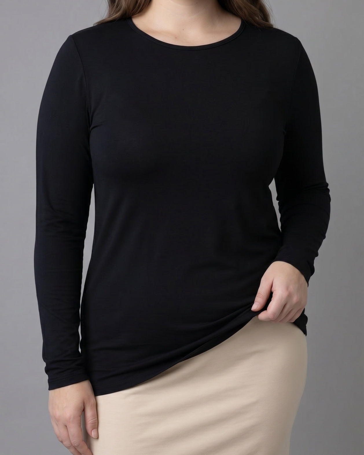 Model wearing Nuggles® Long Sleeve Essential Tee in Black