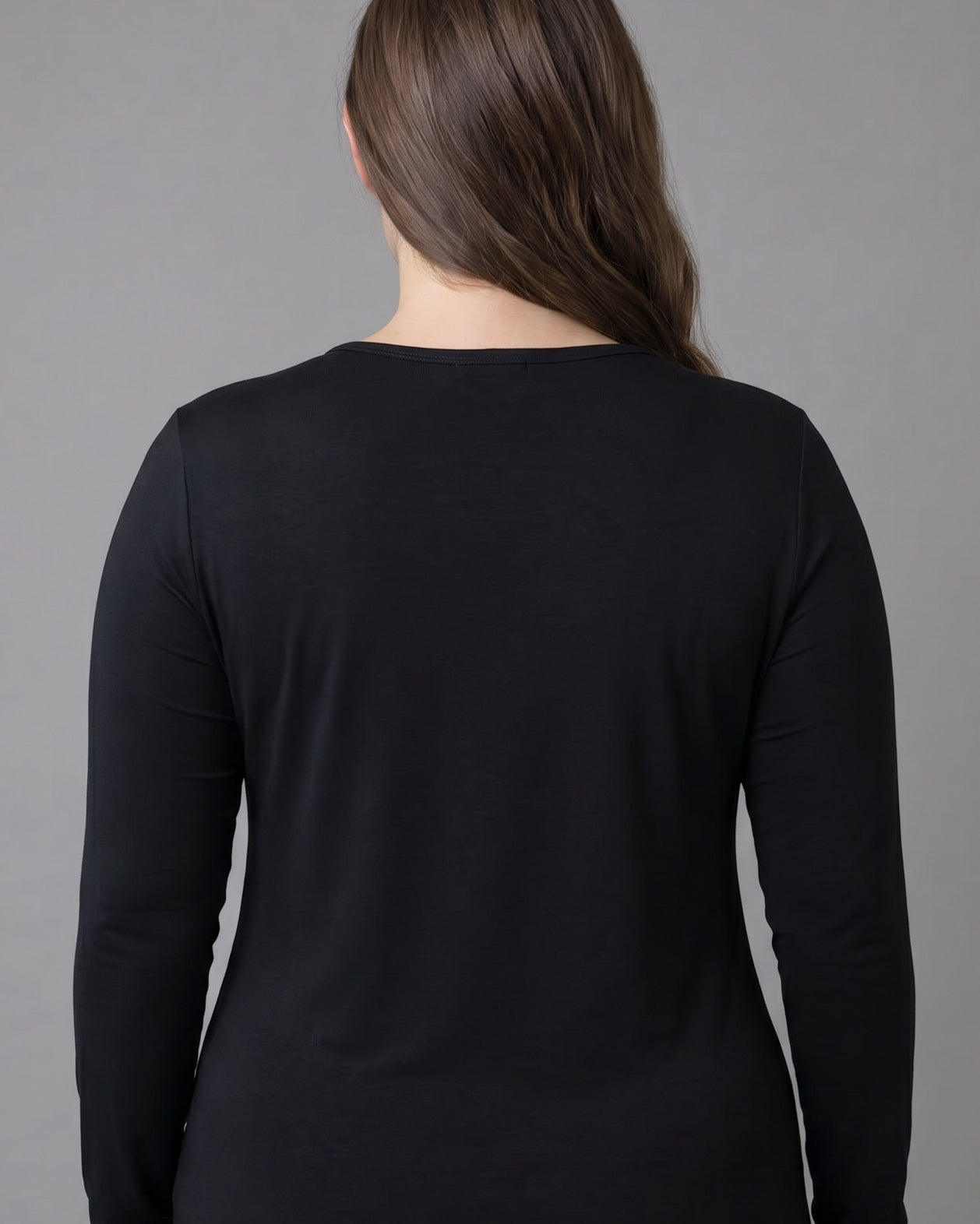 Model wearing Nuggles® Long Sleeve Essential Tee in Black