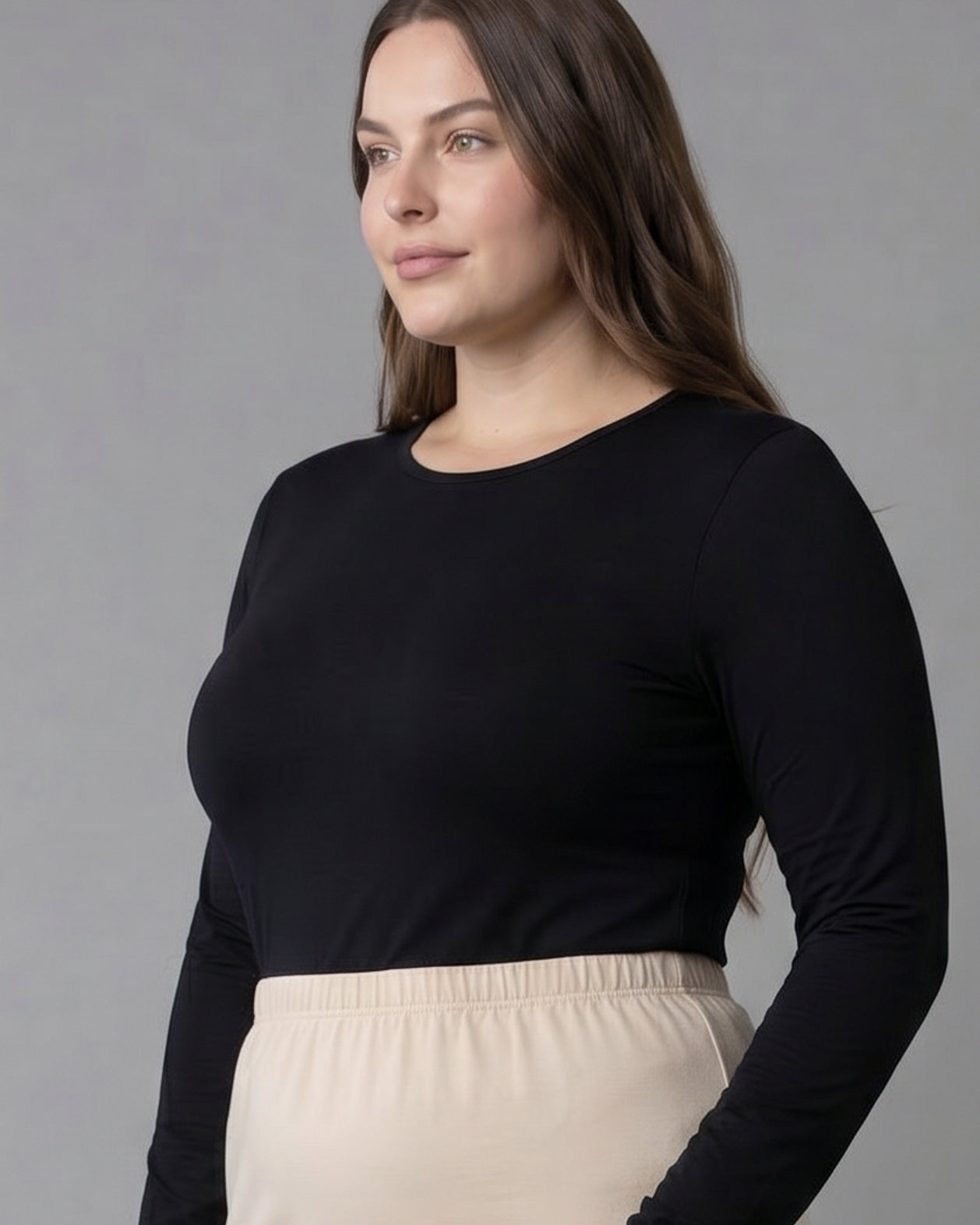 Model wearing Nuggles® Long Sleeve Essential Tee in Black