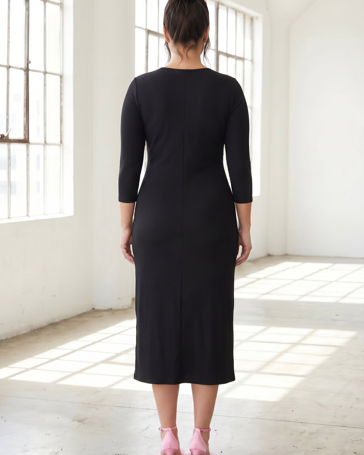 Model wearing Nuggles® Ribbed Midi Layering Dress in Black