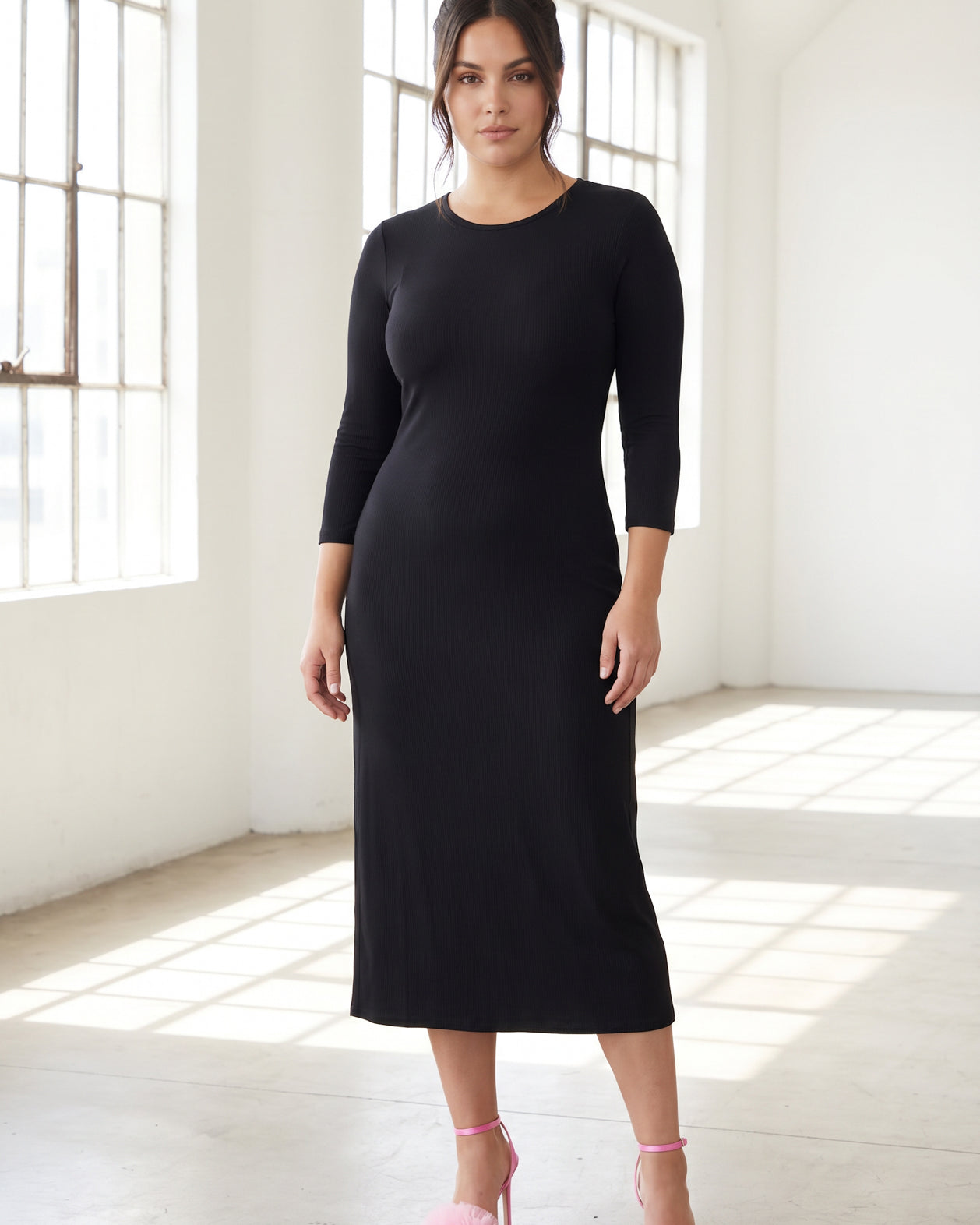 Model wearing Nuggles® Ribbed Midi Layering Dress in Black