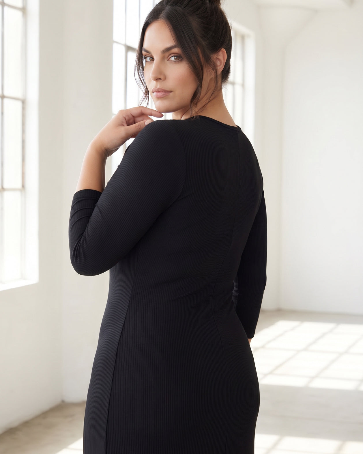 Model wearing Nuggles® Ribbed Midi Layering Dress in Black