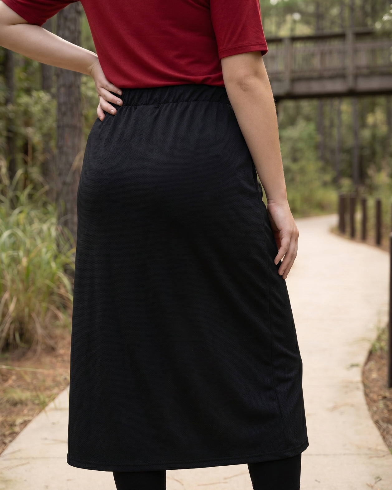 Model wearing Nuggles® 31" All-Sport Skirt in Black