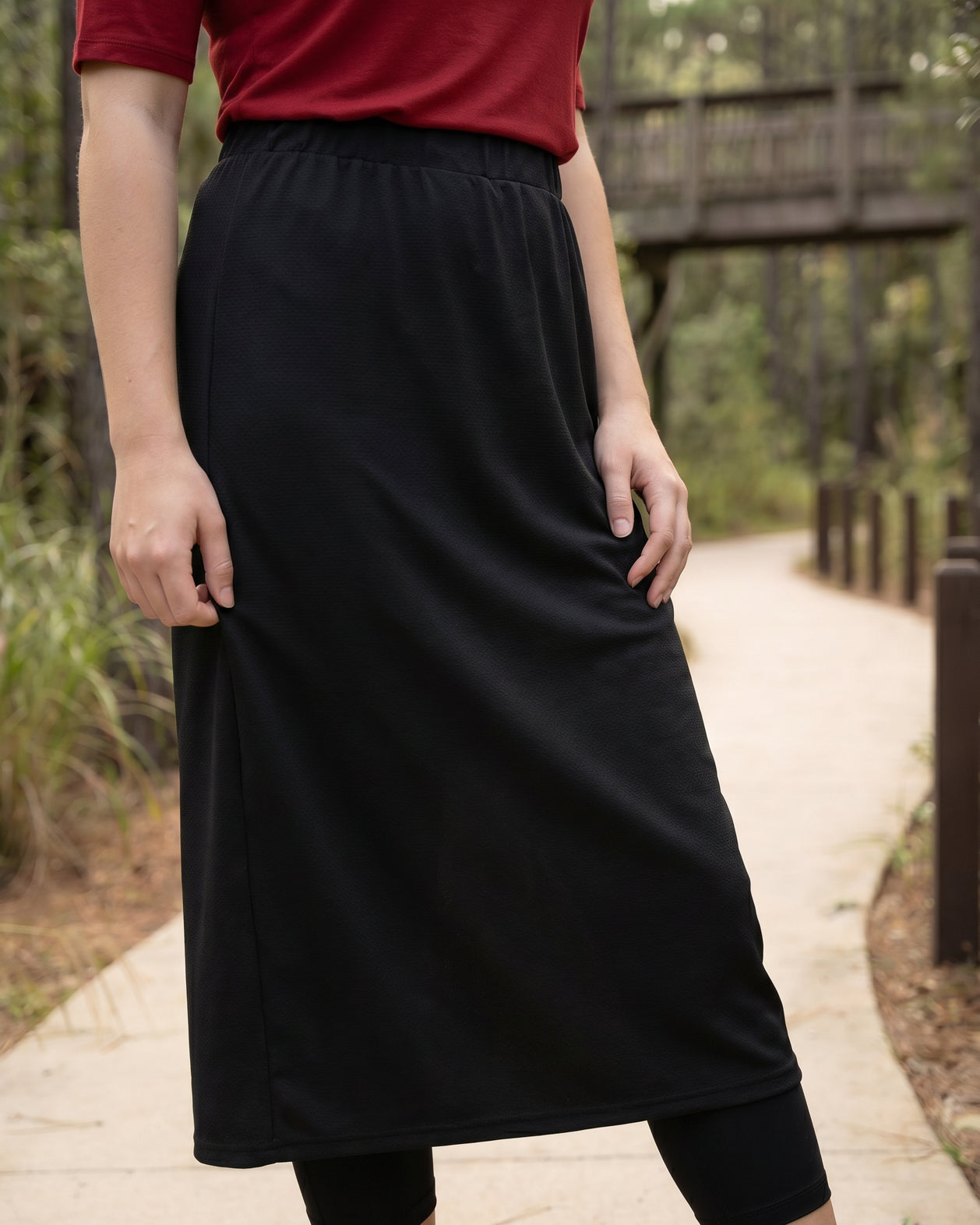 Model wearing Nuggles® 31" All-Sport Skirt in Black