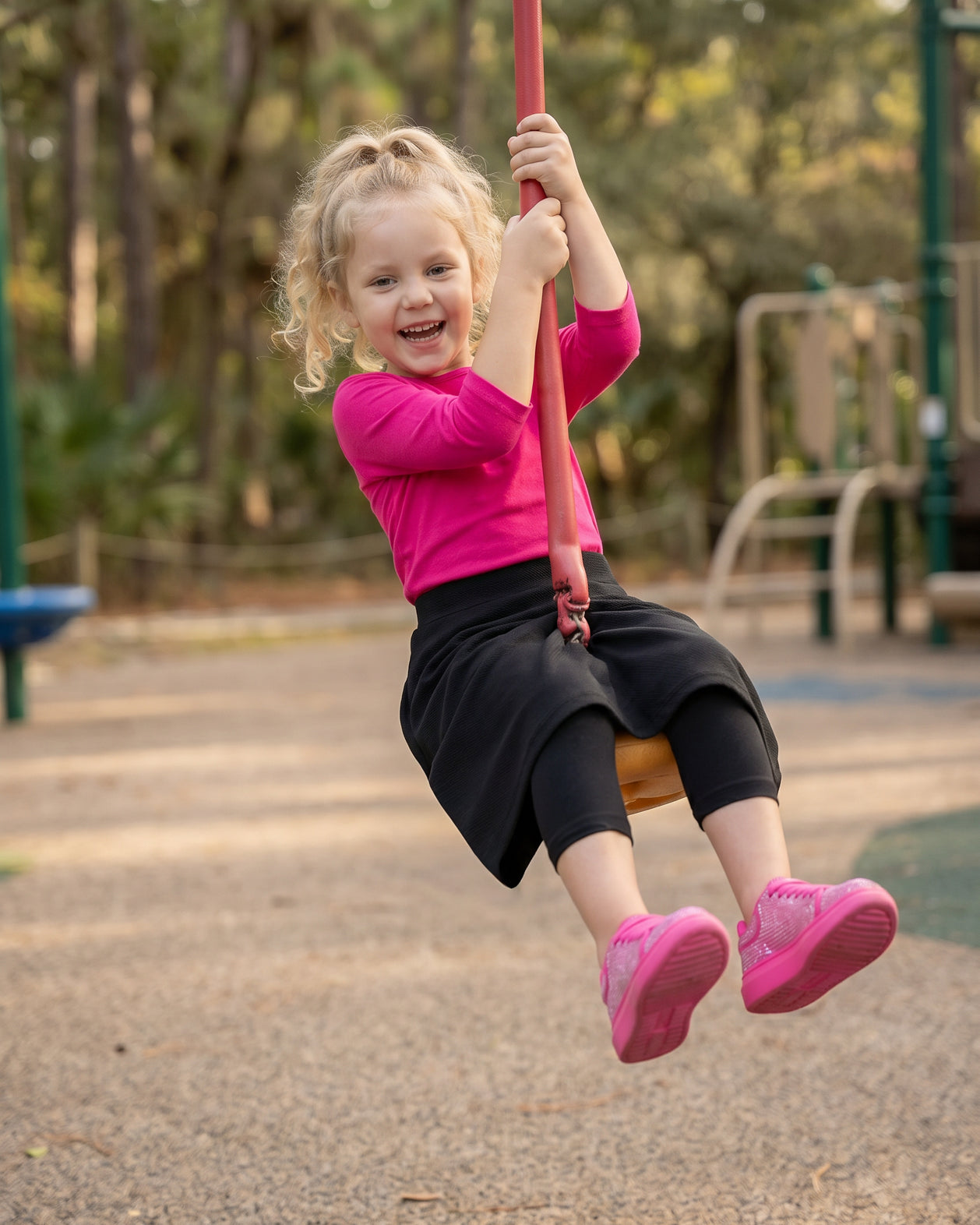 Model wearing Nuggles® Girls All-Sport Skirt in Black