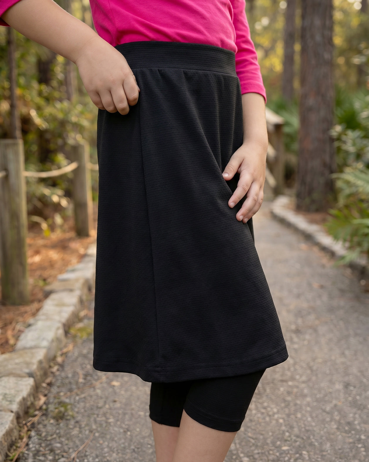 Model wearing Nuggles® Girls All-Sport Skirt in Black