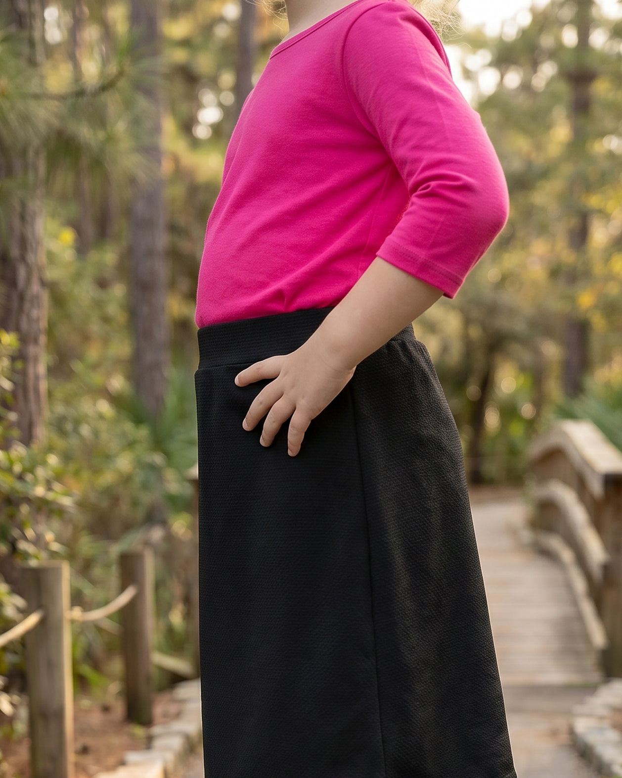 Model wearing Nuggles® Girls All-Sport Skirt in Black