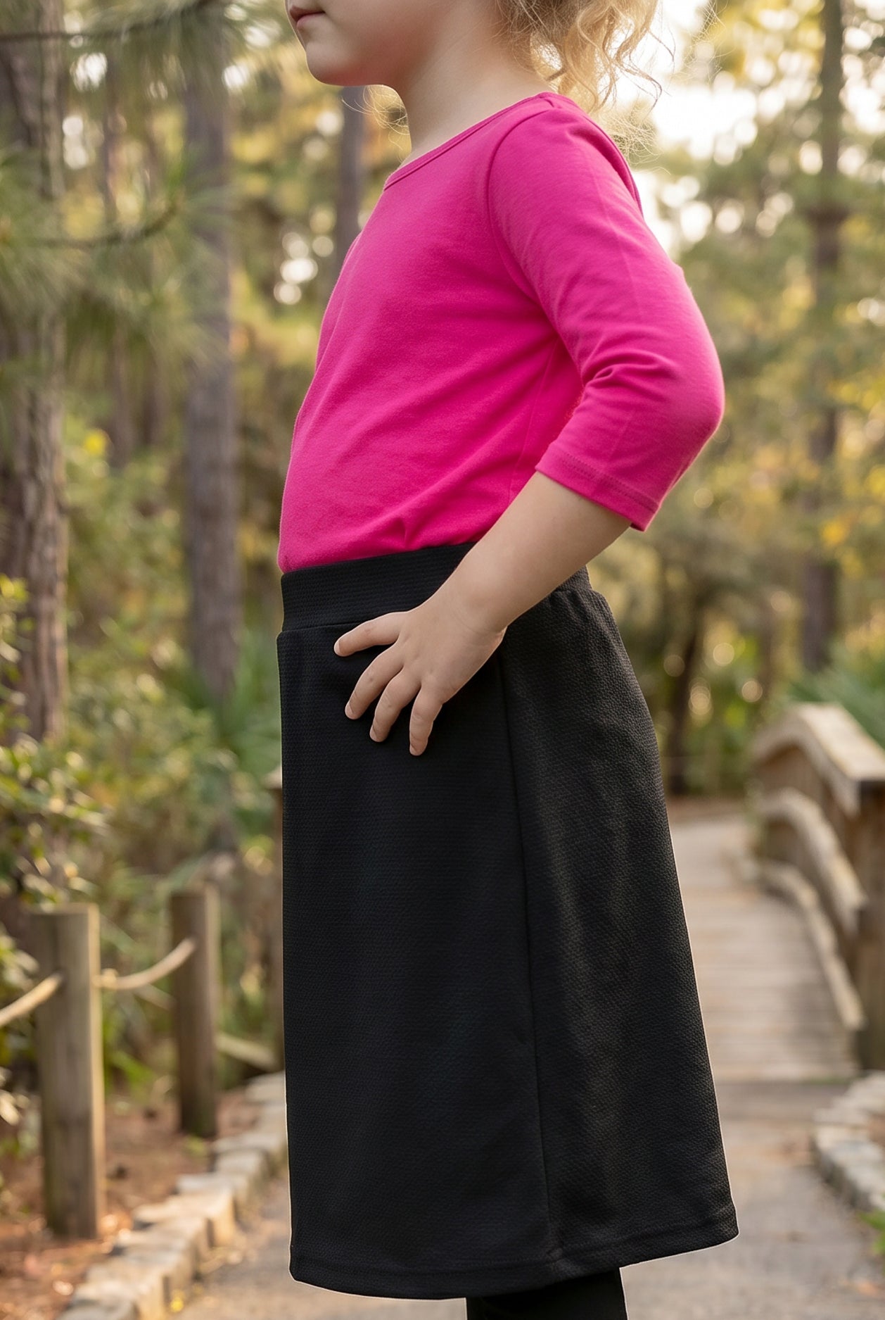 Model wearing Nuggles® Girls All-Sport Skirt in Black