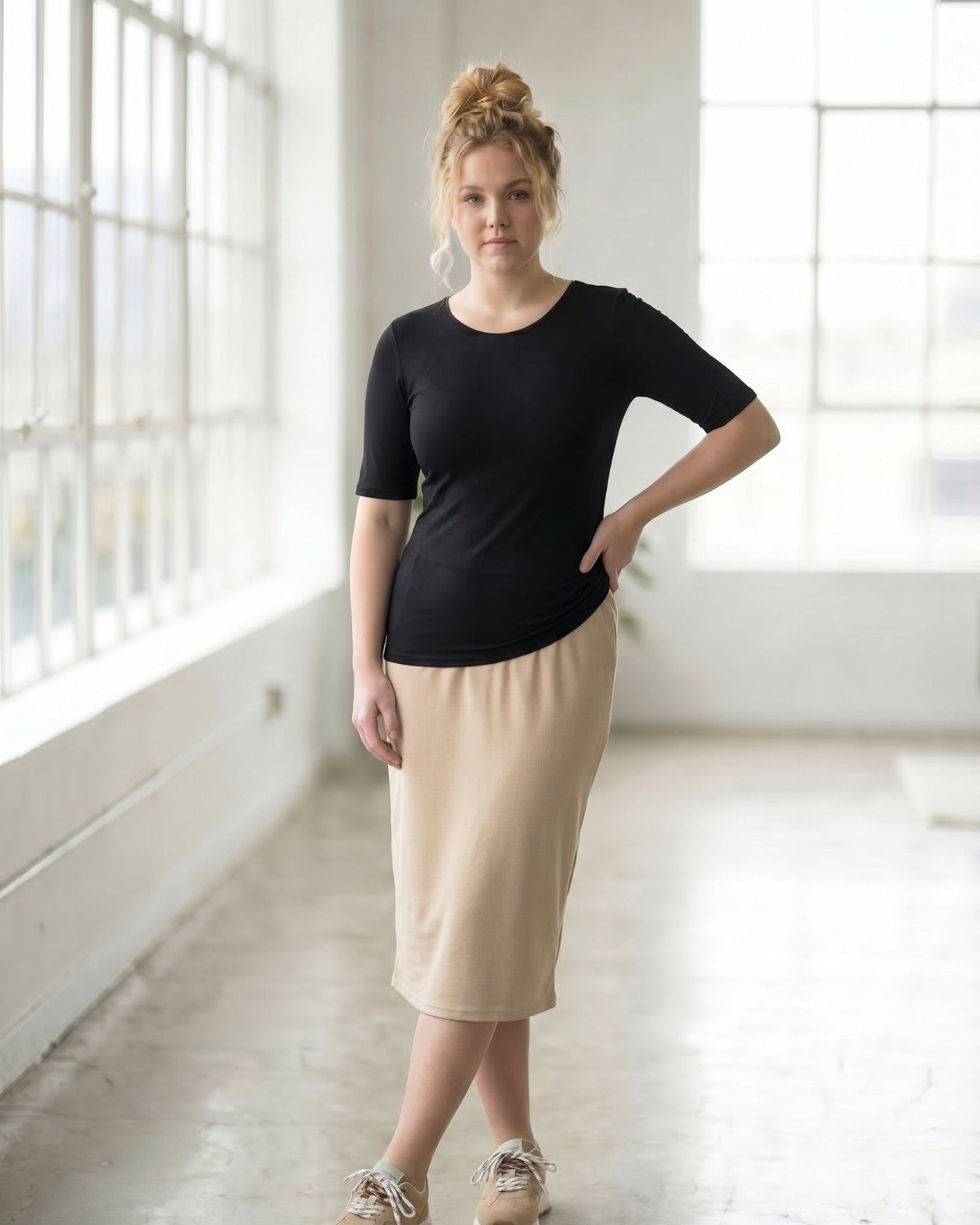 Model wearing the Nuggles® Essential Half Sleeve Tee in Black
