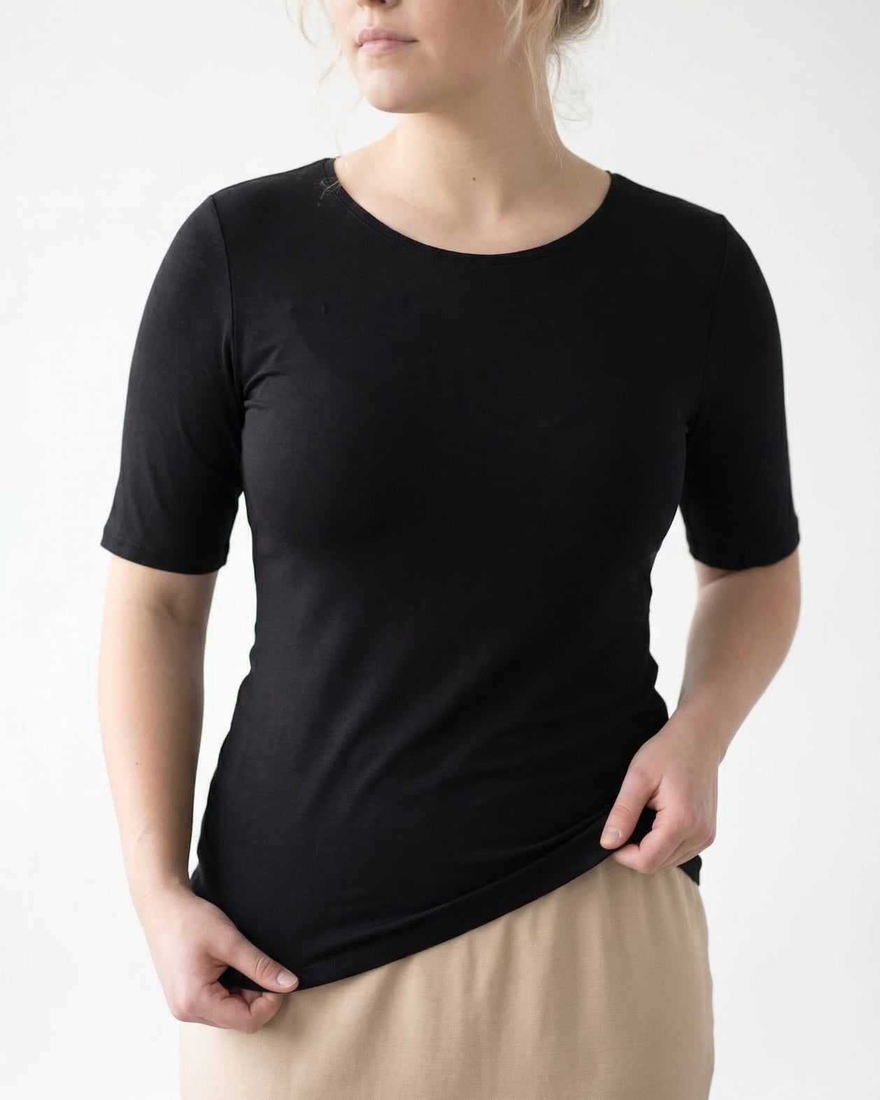 Model wearing the Nuggles® Essential Half Sleeve Tee in Black