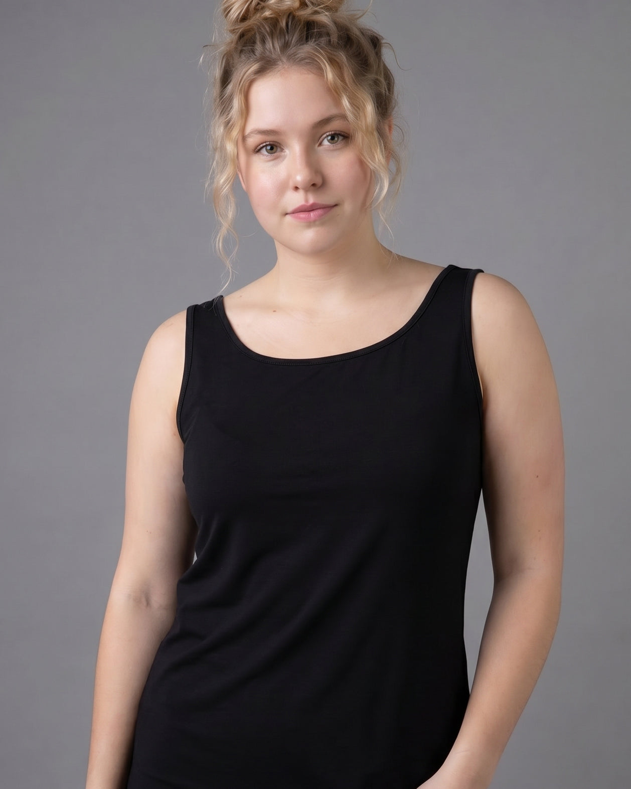 Model wearing Nuggles® Wide Neck Tank in Black