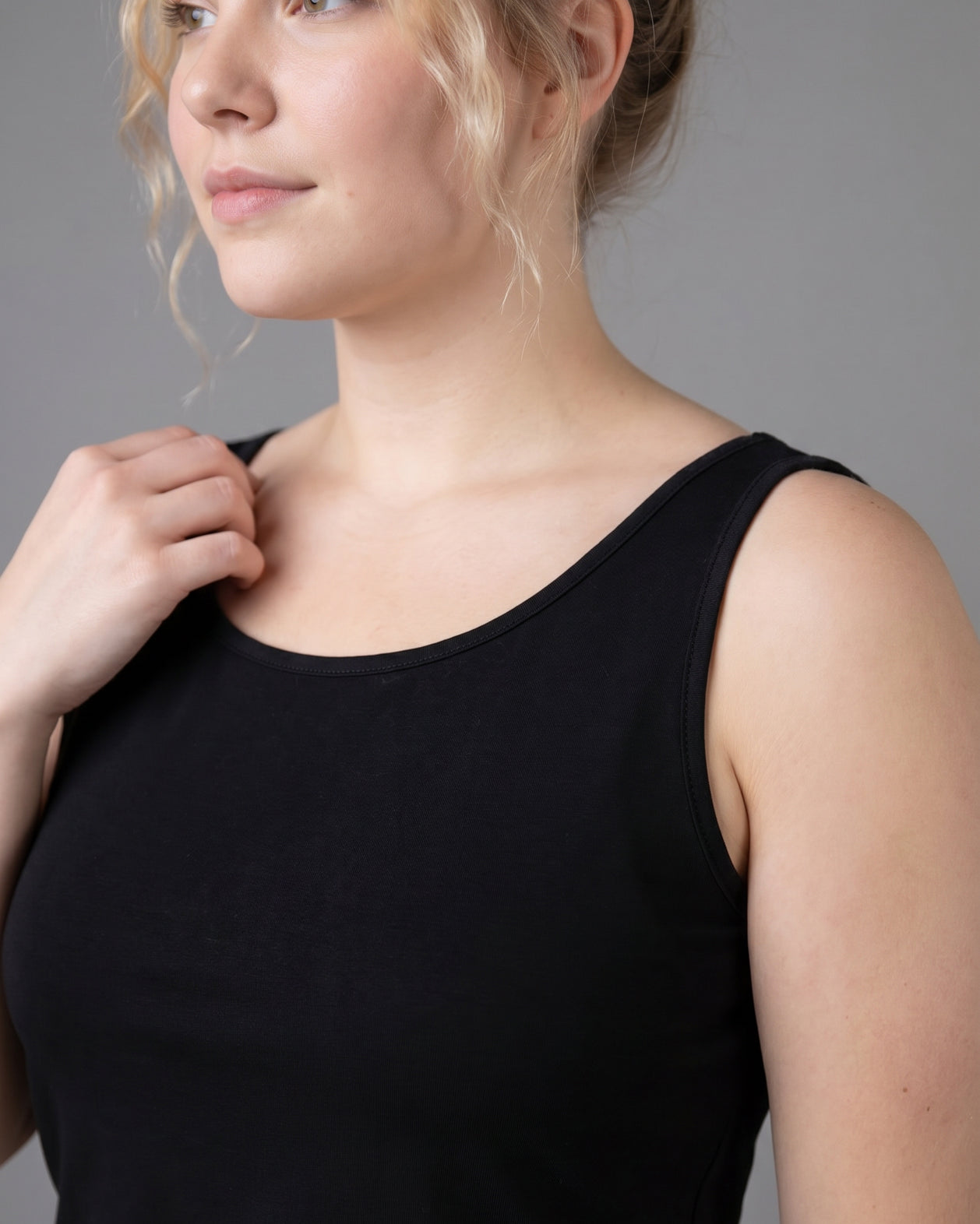 Model wearing Nuggles® Wide Neck Tank in Black