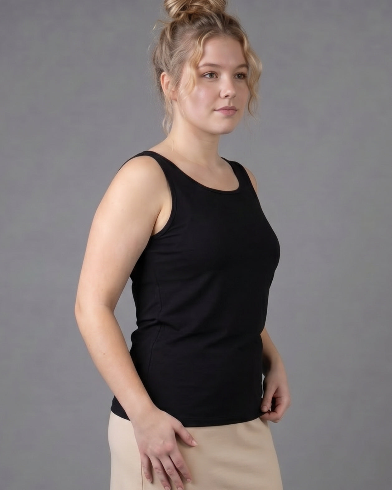 Model wearing Nuggles® Wide Neck Tank in Black