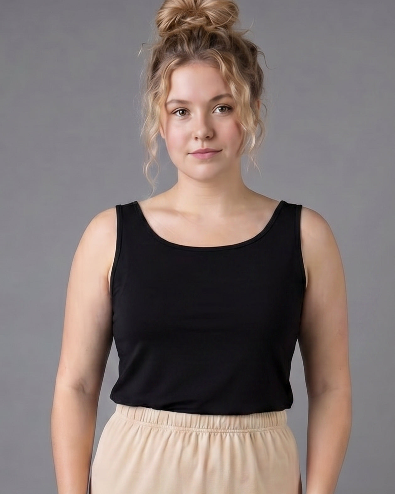 Model wearing Nuggles® Wide Neck Tank in Black