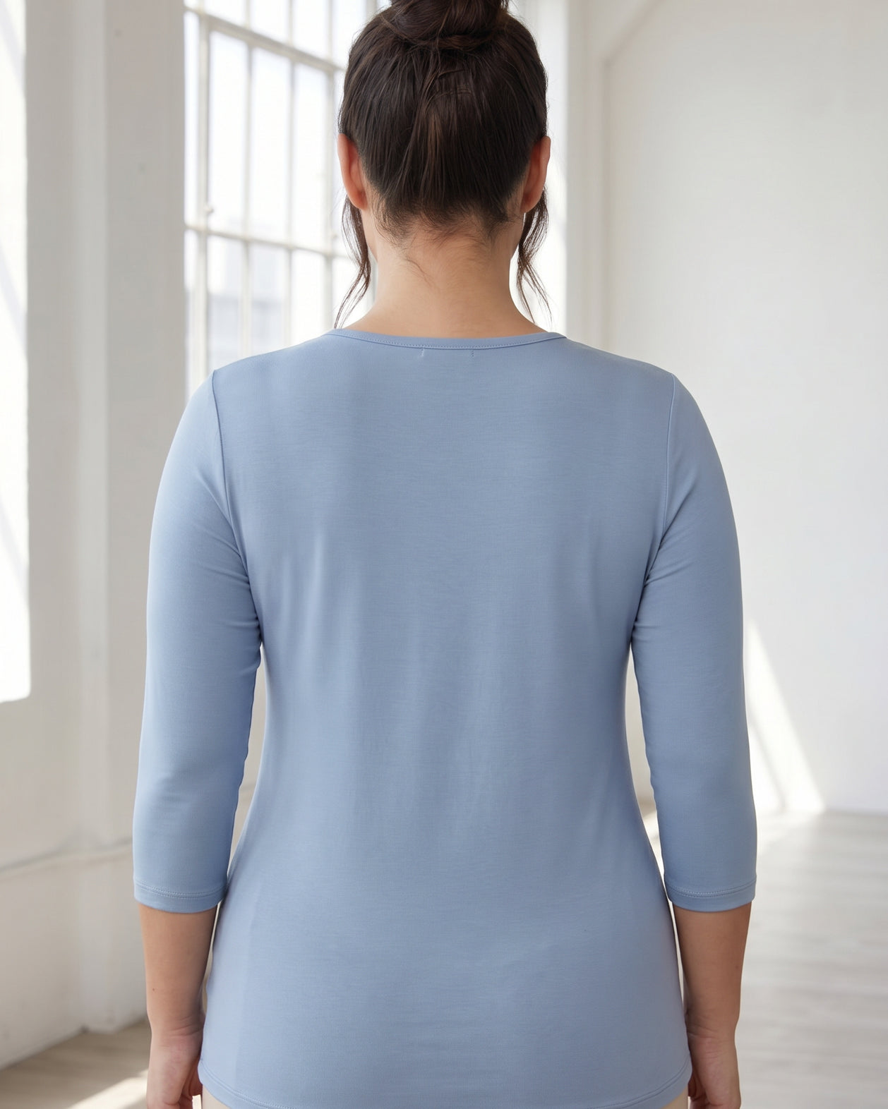 Model wearing Nuggles® 3/4 Essential Tee in Blue Pearl