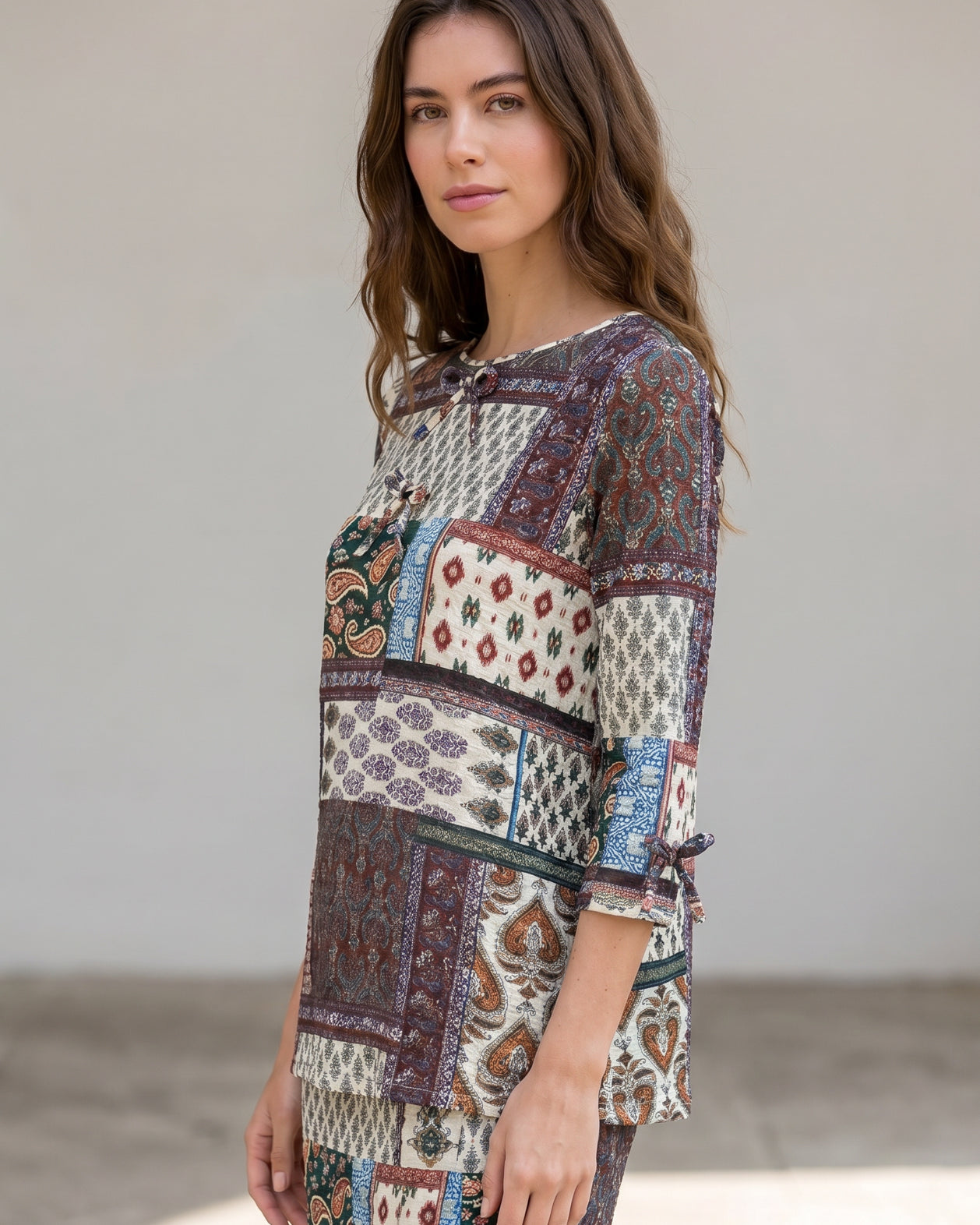 Model wearing Nuggles® Lexi Bow Top in Boho Patchwork