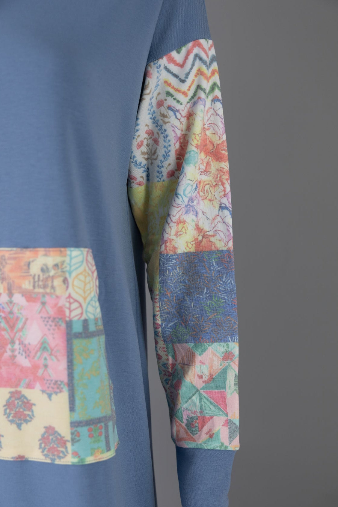 Model wearing Nuggles® Hoodie Dress in Boho Mosaic