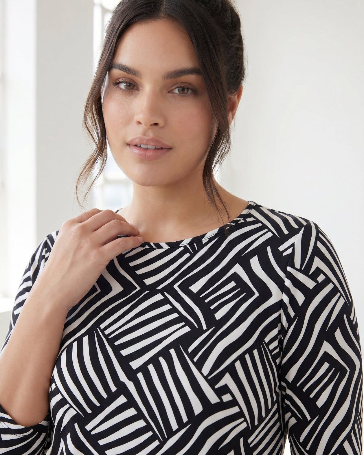 Model wearing Nuggles® 3/4 Essential Tee in Bold Lines