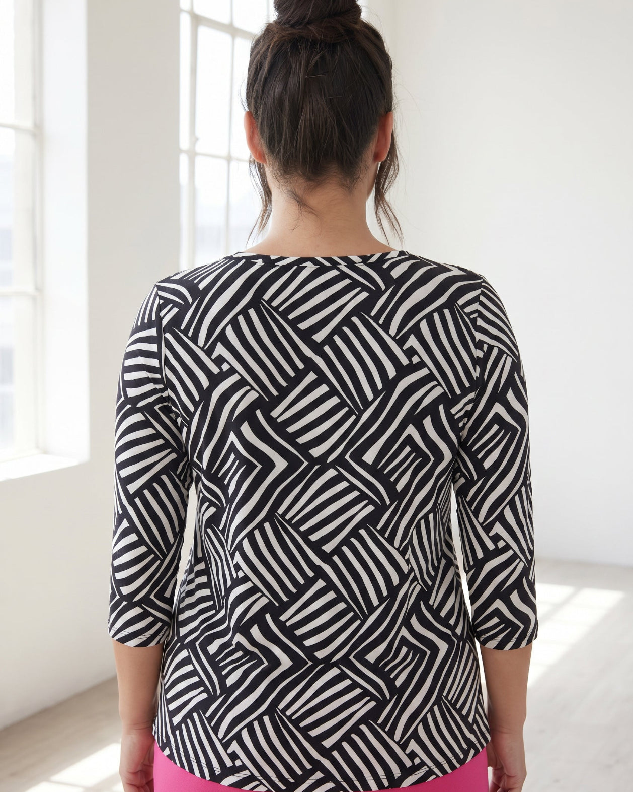 Model wearing Nuggles® 3/4 Essential Tee in Bold Lines