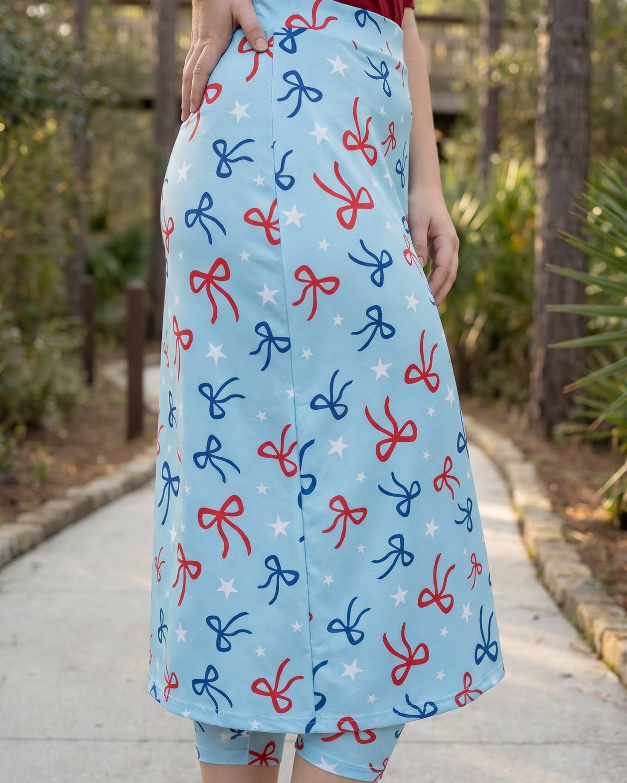 Model wearing Nuggles® 31" All-Sport Skirt in Bow Active