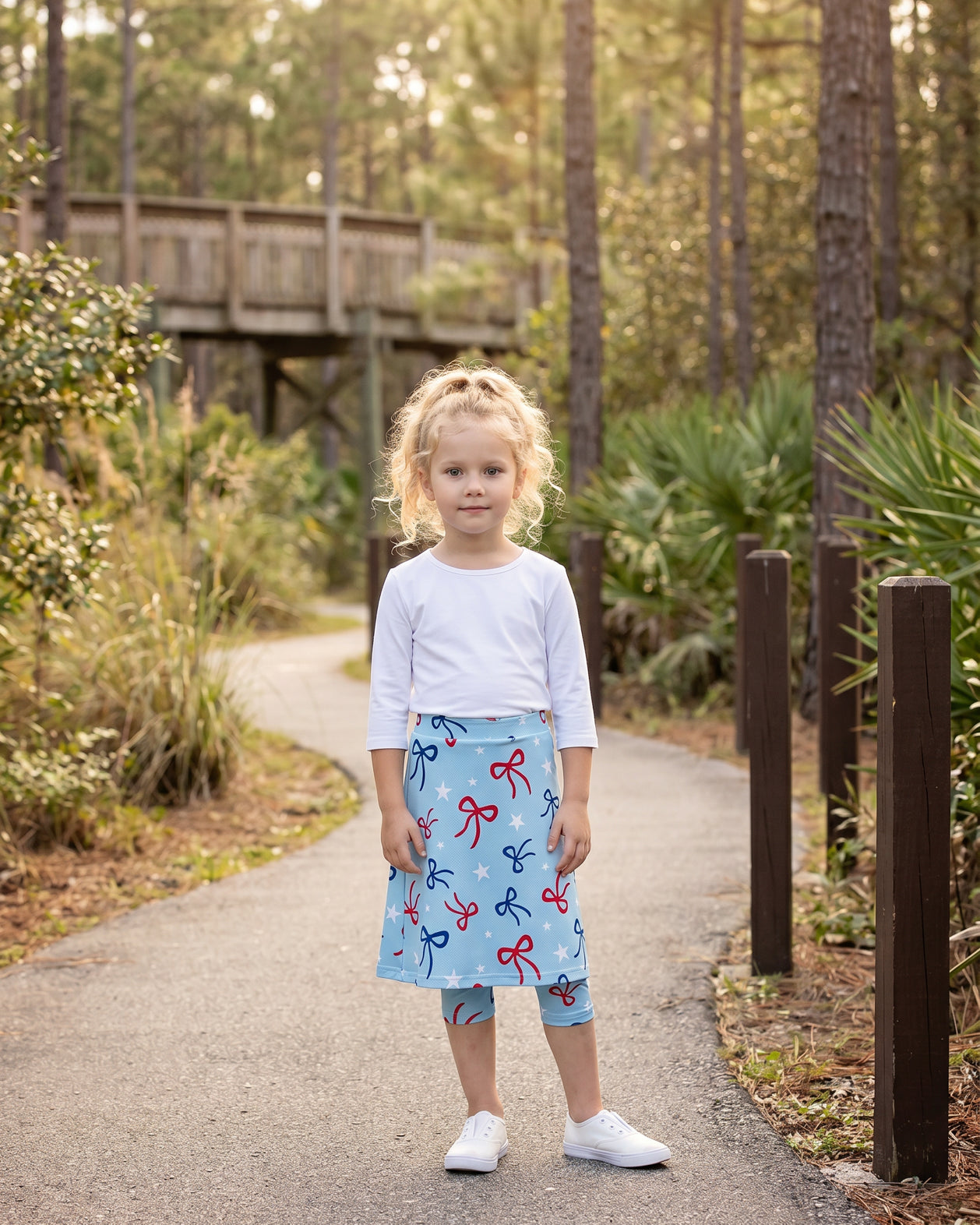 Model wearing Nuggles® Girls All-Sport Skirt in Bow Active