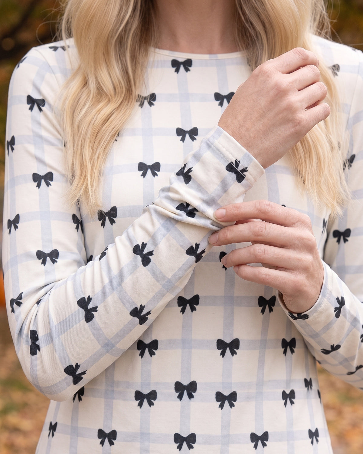 Model wearing Nuggles® Long Sleeve Essential Tee in Bow Check