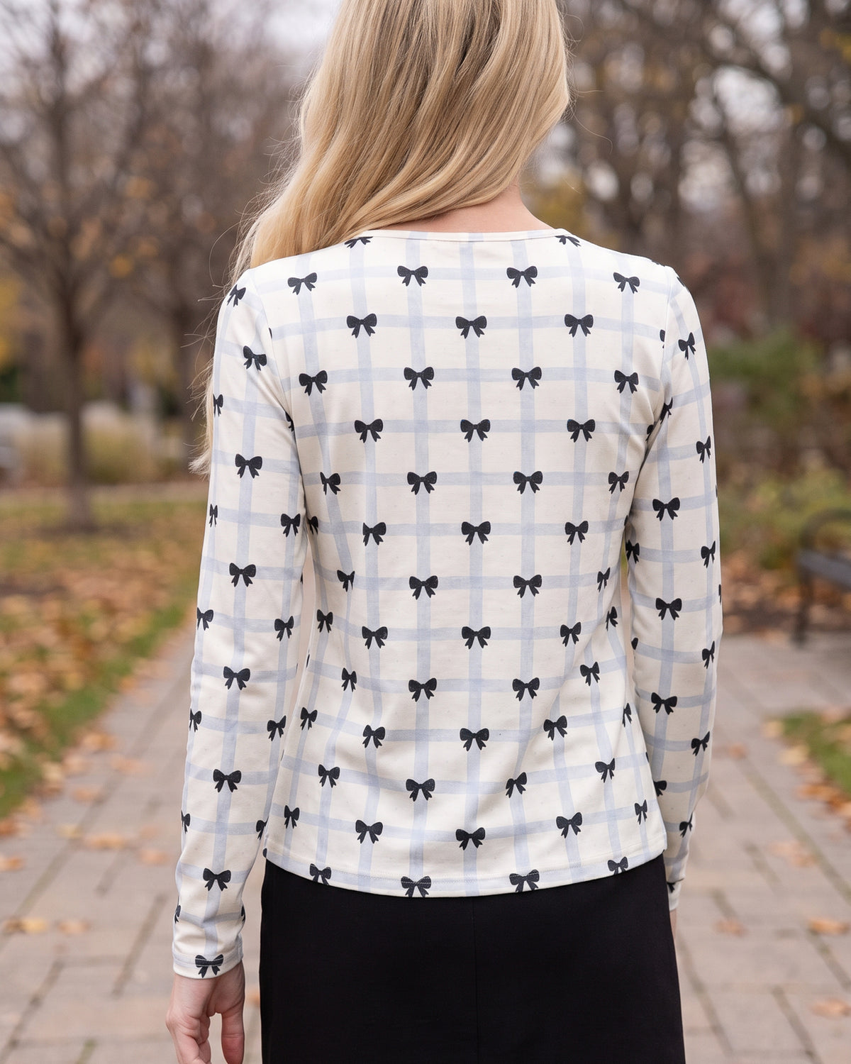 Model wearing Nuggles® Long Sleeve Essential Tee in Bow Check