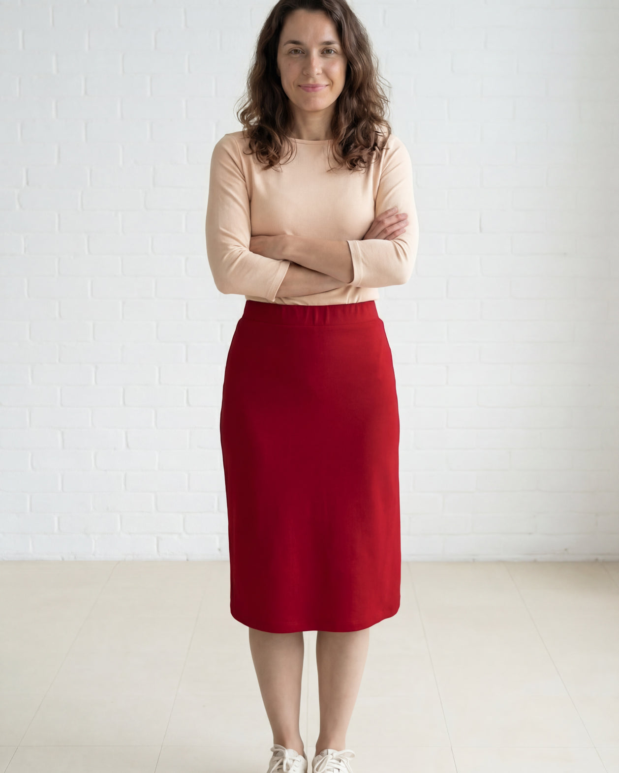 Model wearing Nuggles® 27" Relaxed Midi Skirt in Brick Red