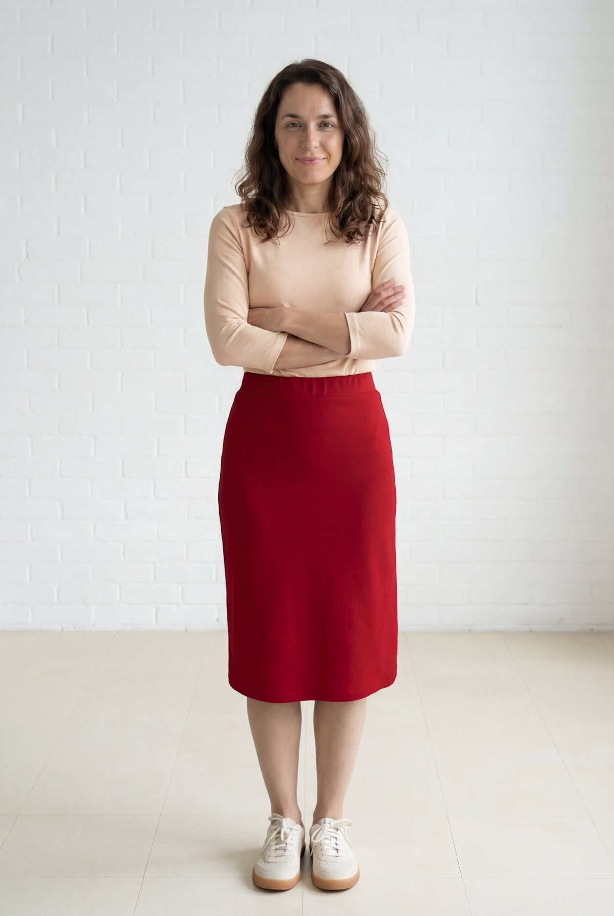 Model wearing Nuggles® 27" Relaxed Midi Skirt in Brick Red