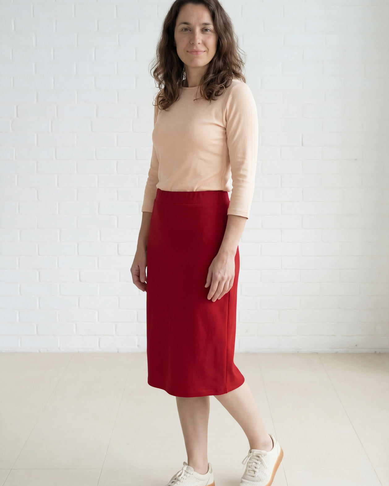 Model wearing Nuggles® 27" Relaxed Midi Skirt in Brick Red