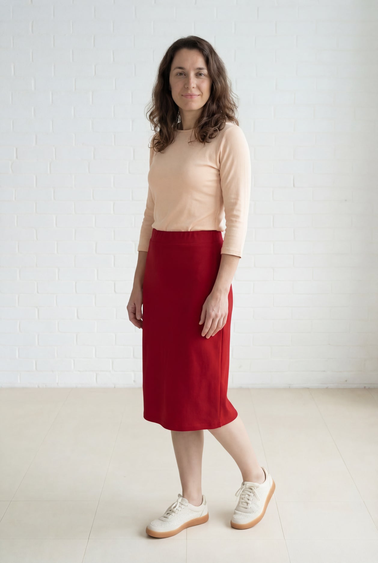 Model wearing Nuggles® 27" Relaxed Midi Skirt in Brick Red