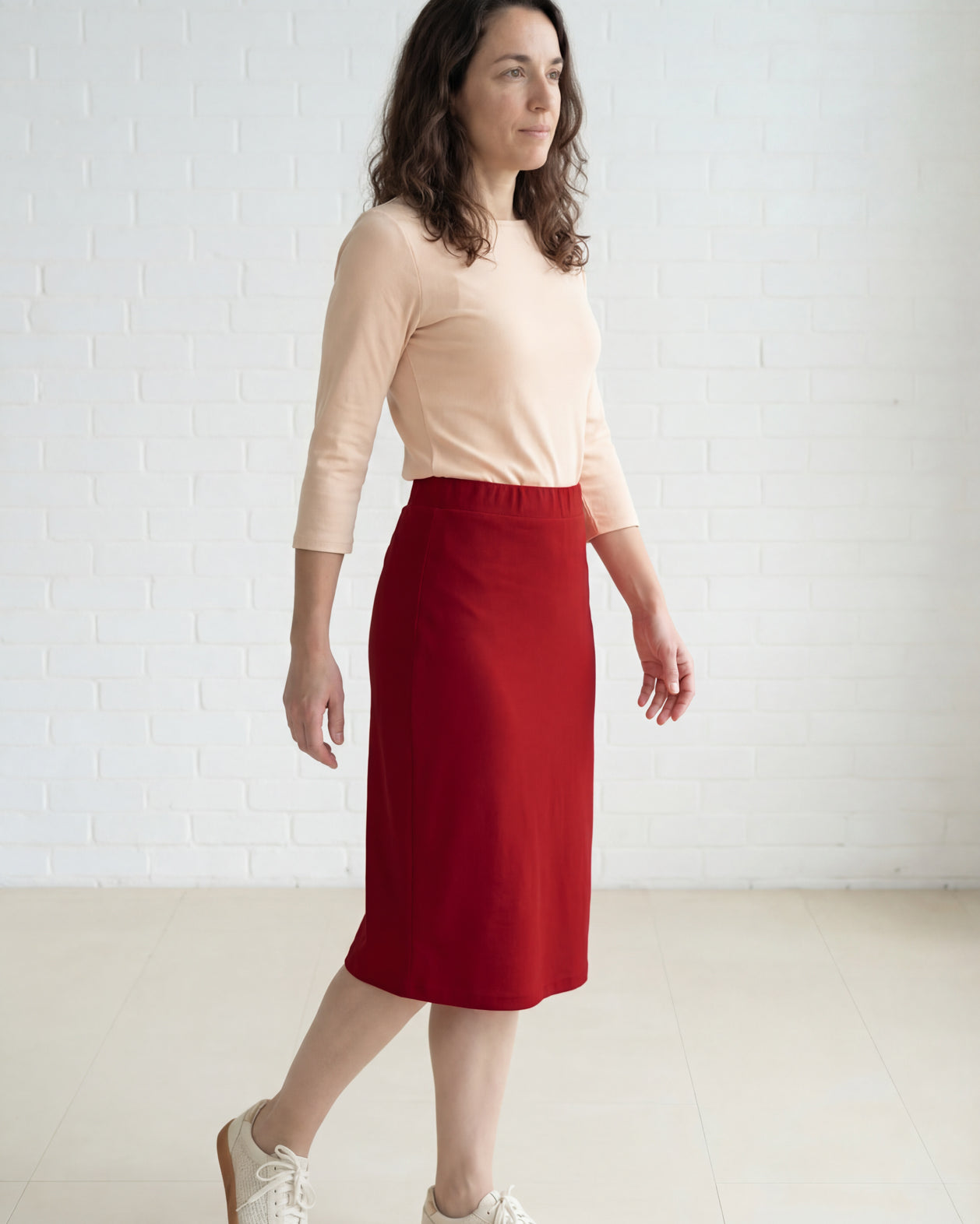 Model wearing Nuggles® 27" Relaxed Midi Skirt in Brick Red