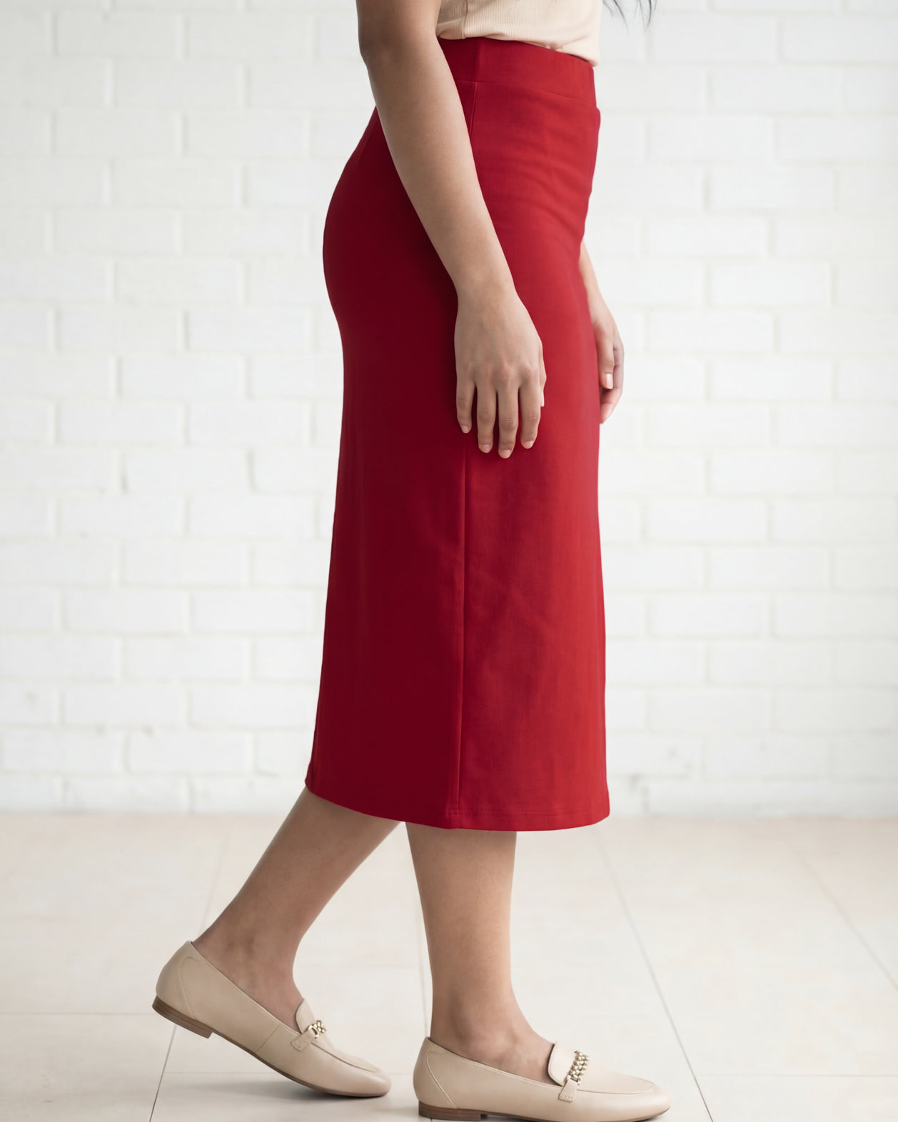 Model wearing Nuggles® 31" Relaxed Midi Skirt in Brick Red