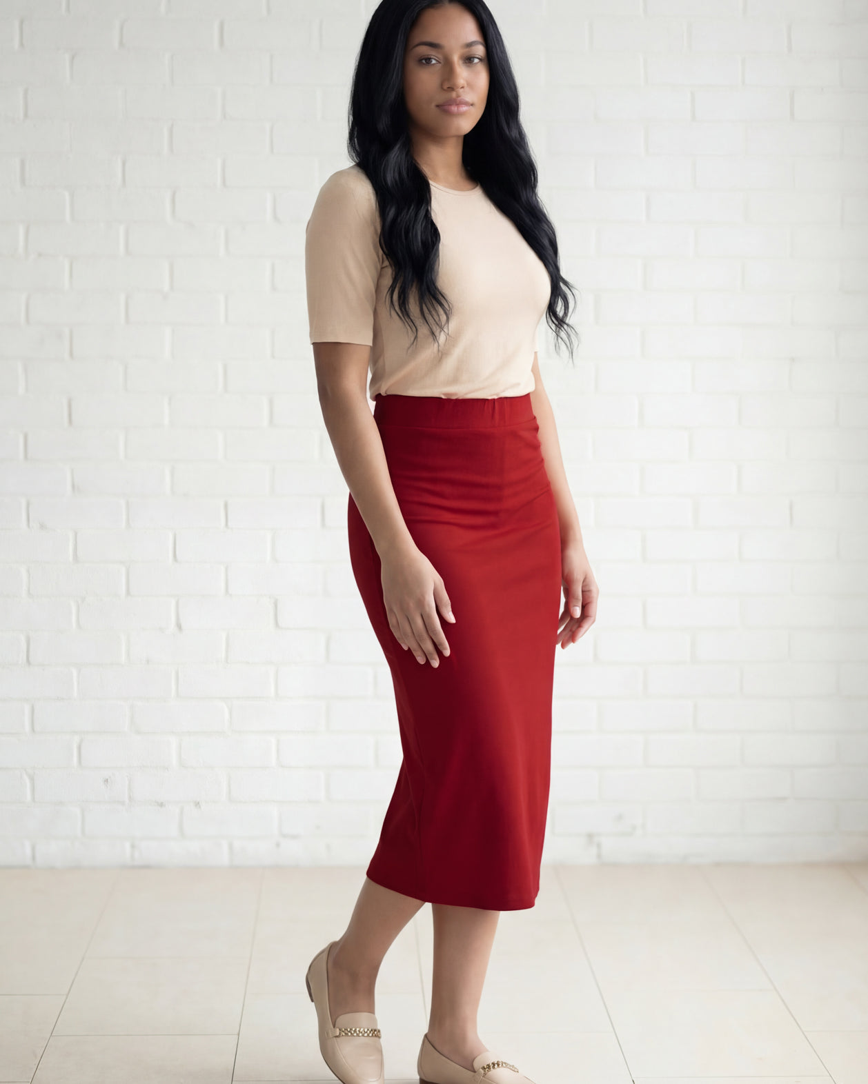 Model wearing Nuggles® 31" Relaxed Midi Skirt in Brick Red
