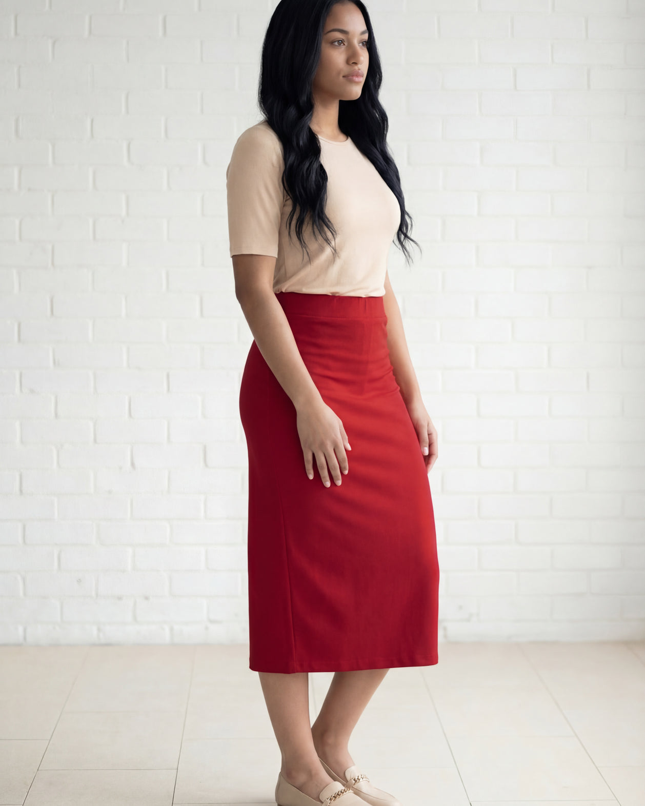 Model wearing Nuggles® 31" Relaxed Midi Skirt in Brick Red