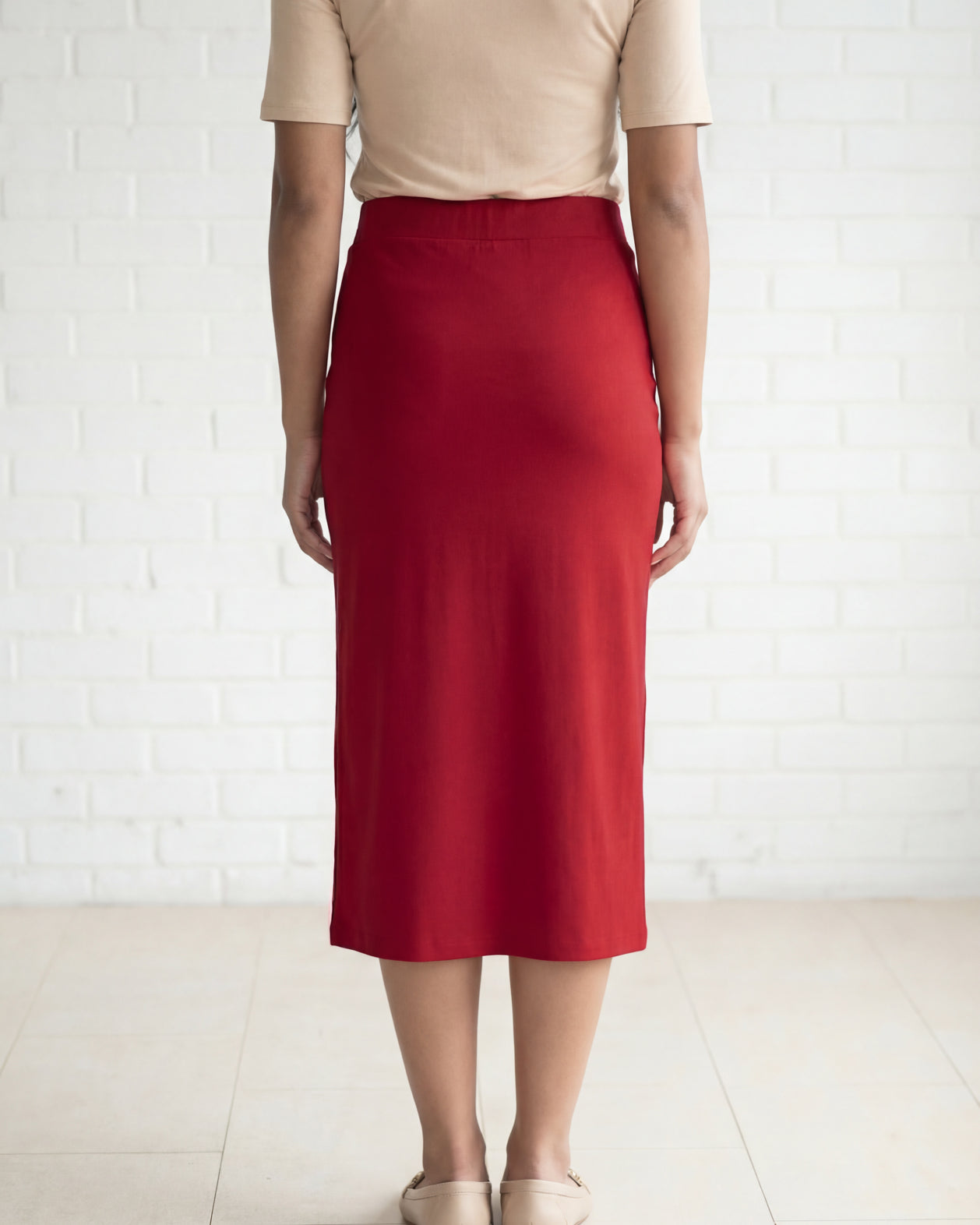 Model wearing Nuggles® 31" Relaxed Midi Skirt in Brick Red