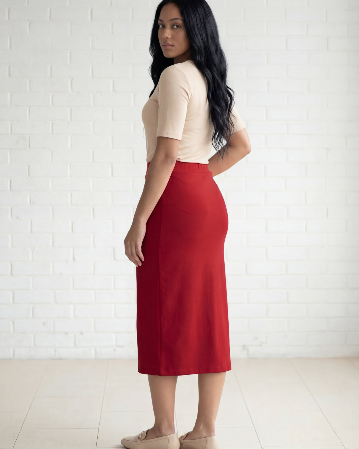 Model wearing Nuggles® 31" Relaxed Midi Skirt in Brick Red