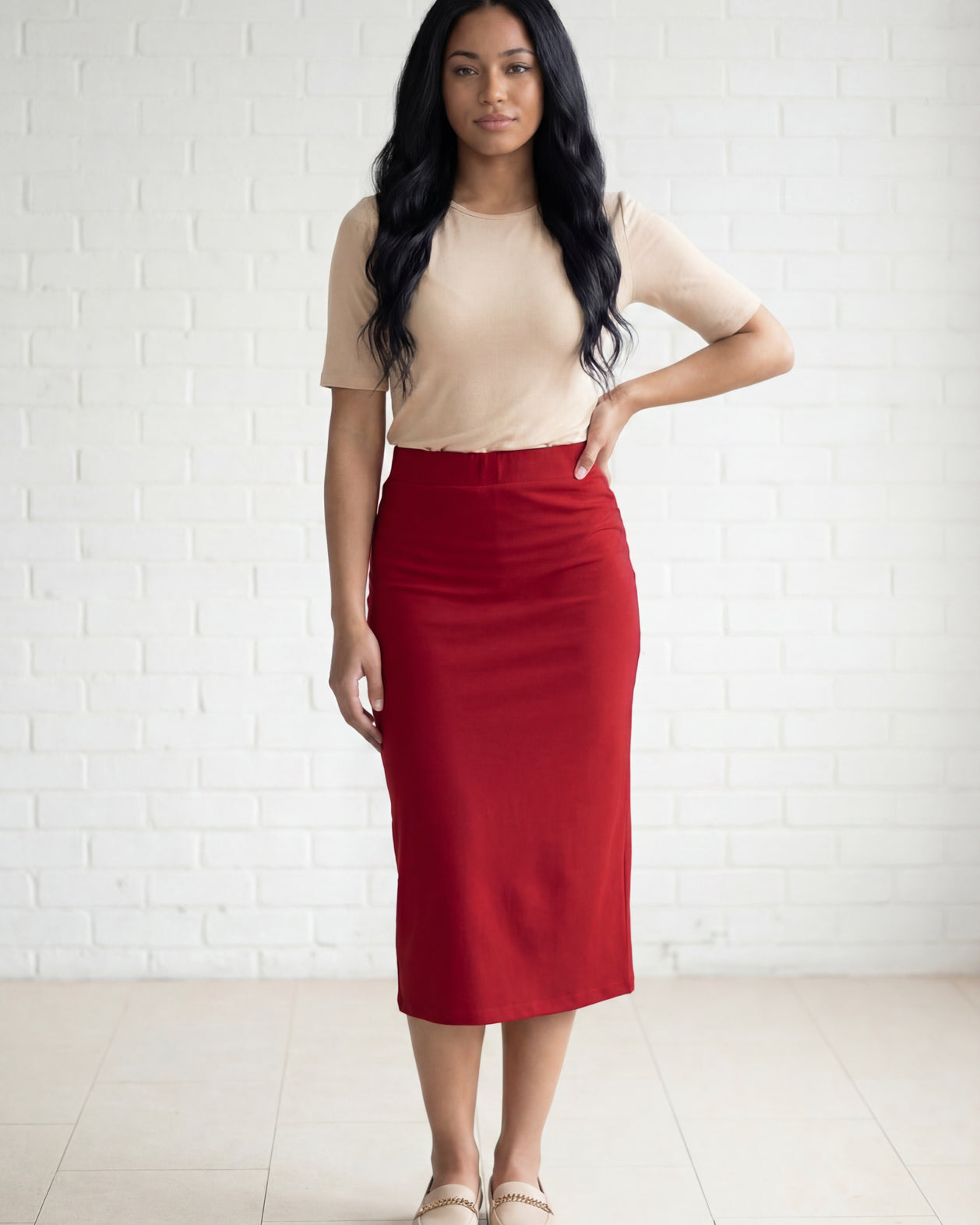 Model wearing Nuggles® 31" Relaxed Midi Skirt in Brick Red